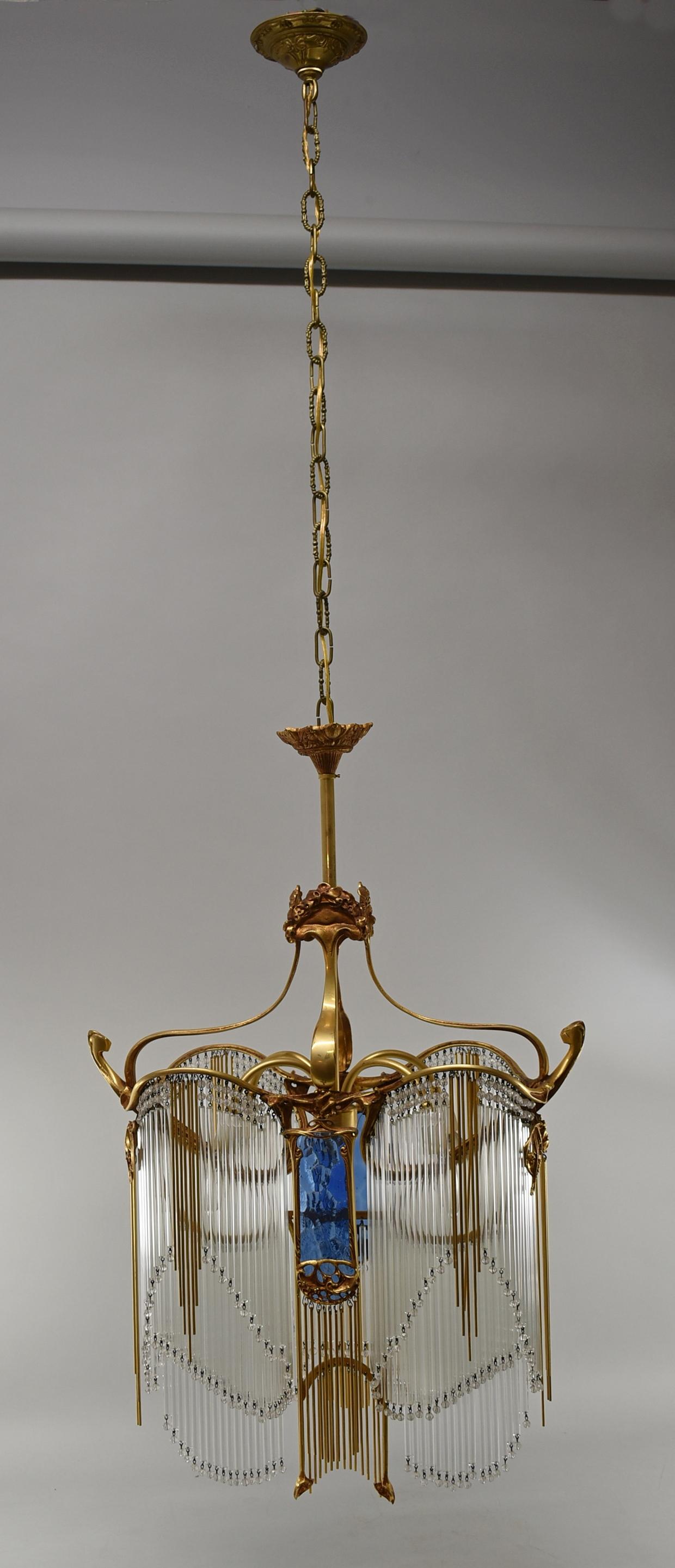 Art Nouveau drop crystal and bronze chandelier by Hector Guimard (1867--1942) Guimard was a French architect and interior designer of Art Nouveau objects.