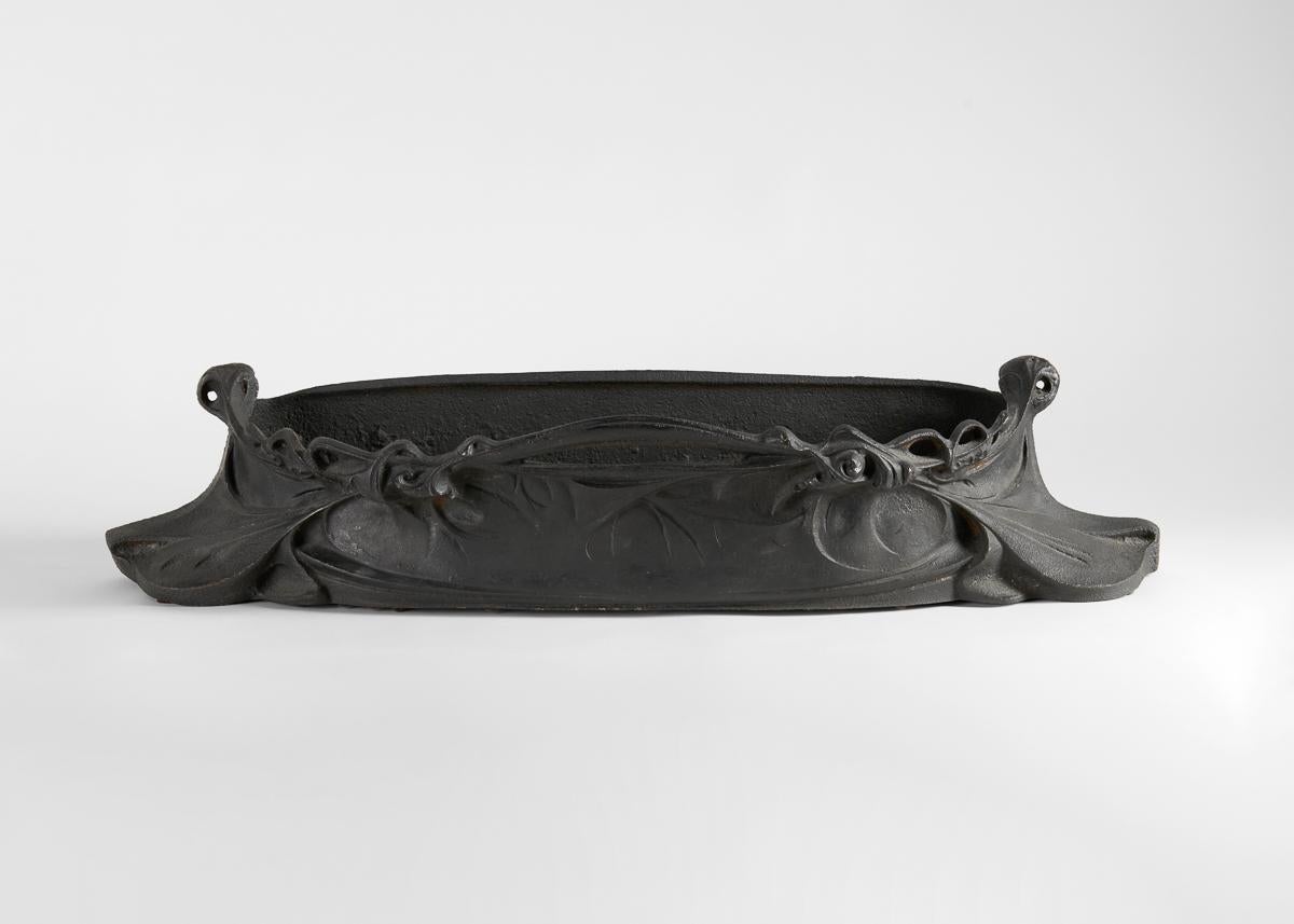 A patinated iron jardinière by one of the most prominent architects and designers of the Art Nouveau style, especially renowned for his designs in this period of the elaborate entrances to the Paris Metro. With this marvelous piece, Guimard embodies