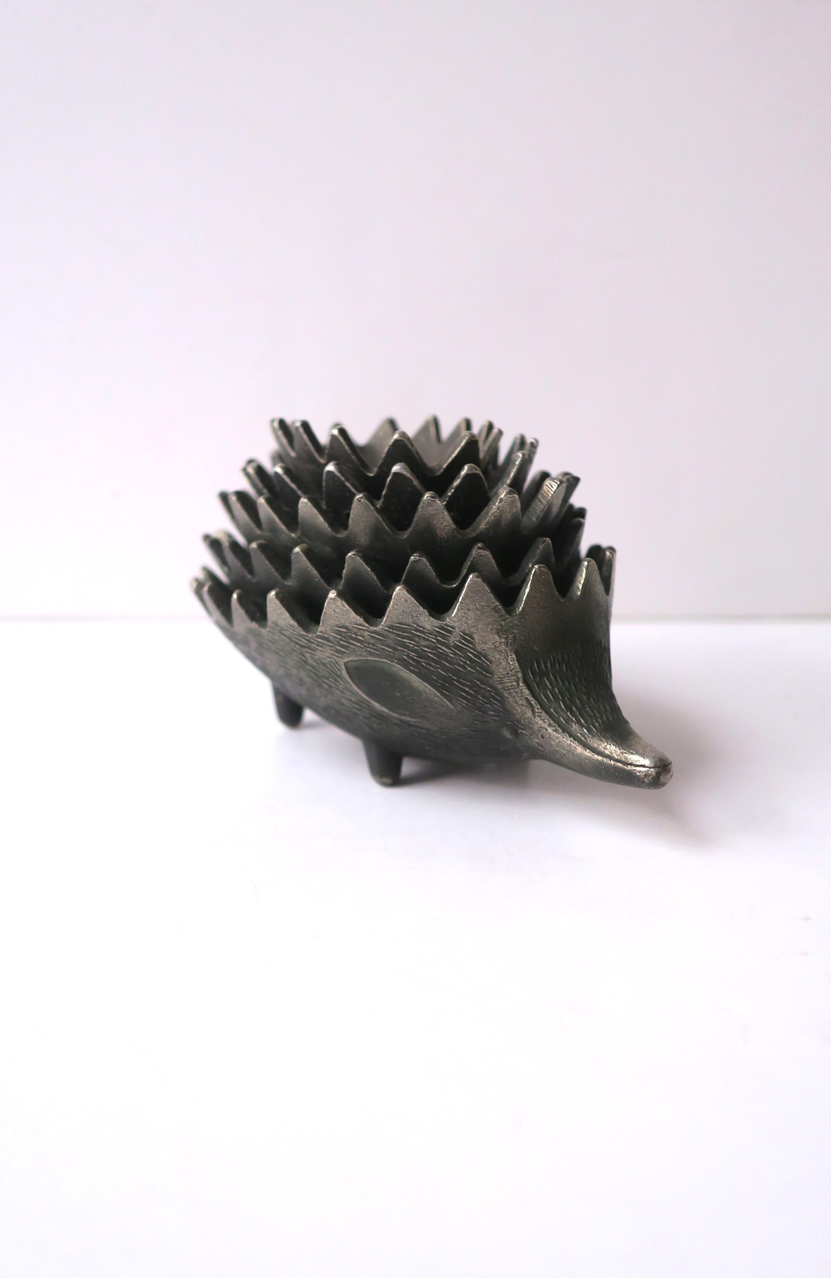 A set of five (5) stackable Hedgehog metal bowls, ashtrays, or decorative object, in the style of artist Walter Bosse, Midcentury Modern design period, circa mid-20th century, Europe (maybe Austria or Germany.) Each hedgehog 'bowl' has textured