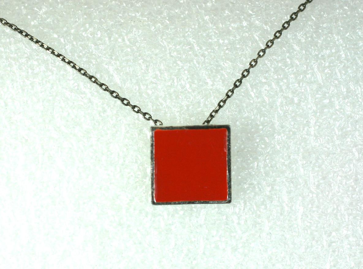 Yves Saint Laurent mens/unisex pendant necklace by Hedi Slimane, Rive Gauche 2003 . Composed of silvertoned flat chain with focal red enamel square pendant, and logo toggle clasp.
 Excellent Condition
 L 16