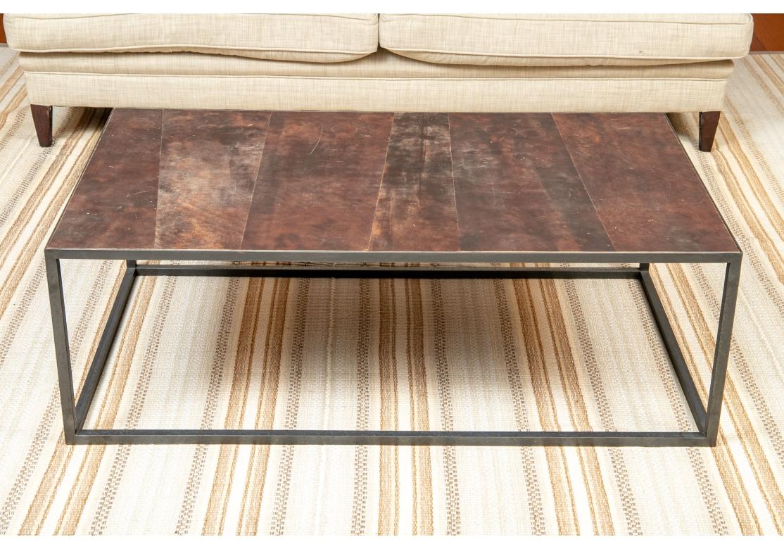 From Belgium. An industrial style leather top cocktail table with metal frame. Alternating planking with visual appeal.

Dimensions: 27 1/2