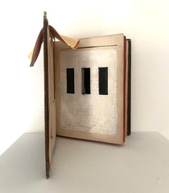 Assemblage in century old excavated book: 'Not Every Window is a Door''