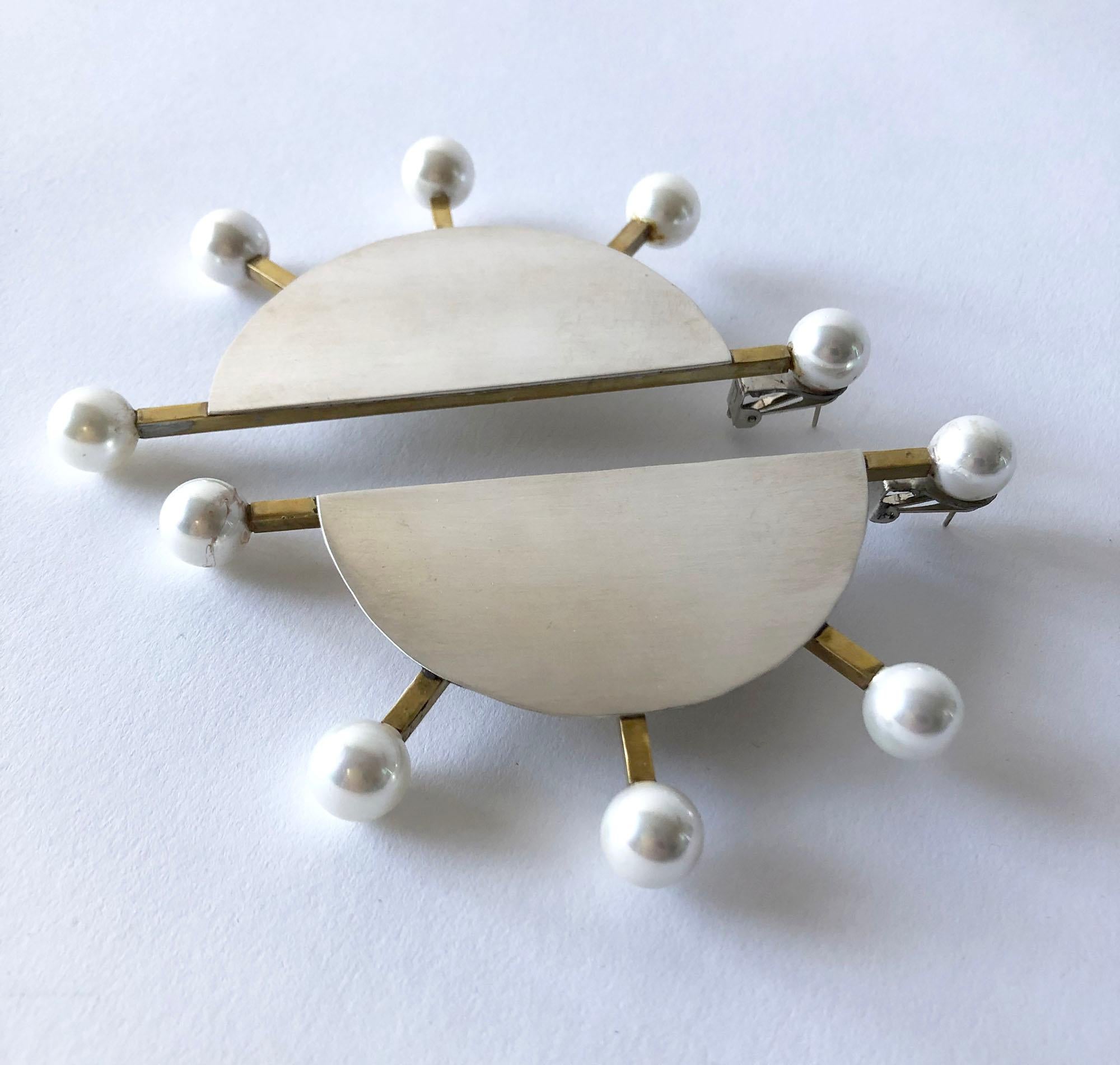 Contemporary earrings of sterling silver and brass with large shell pearl accents created by Heidi Abrahamson of Phoenix, Arizona.  Super deluxe in size and in the 1980's Post Modernist style, they measure 4 5/8