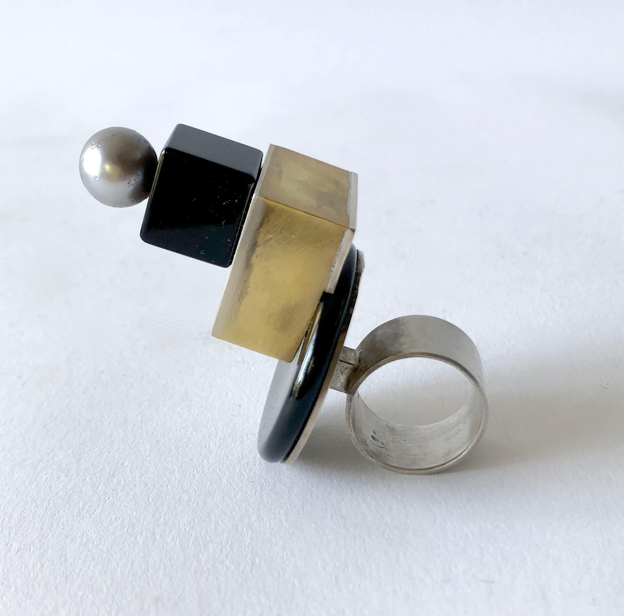 Sterling silver and brass architectural ring with onyx disc and cube, topped off by a Tahitian pearl created by Heidi Abrahamson of Phoenix, Arizona. Ring is a finger size 7.75 - 8 and stands 2