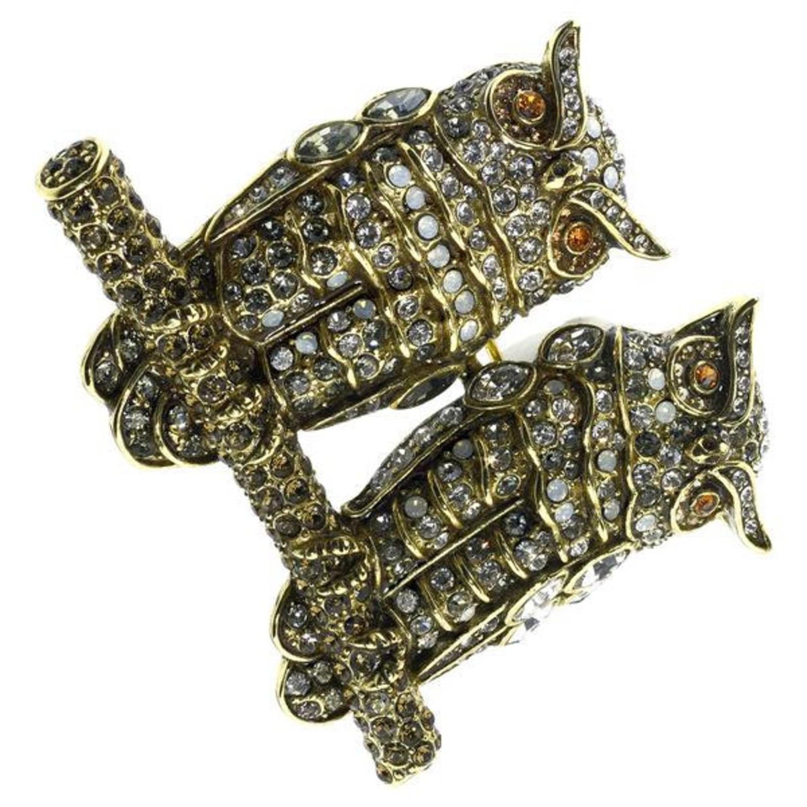 This beguiling pair of owls will enliven every item in your wardrobe. Our Couple Of Owls Crystal Pin features two dazzling owls, fitted with diamond, black diamond, white opal, topaz, smoky quarts, and crystal golden shadow crystals. They sit