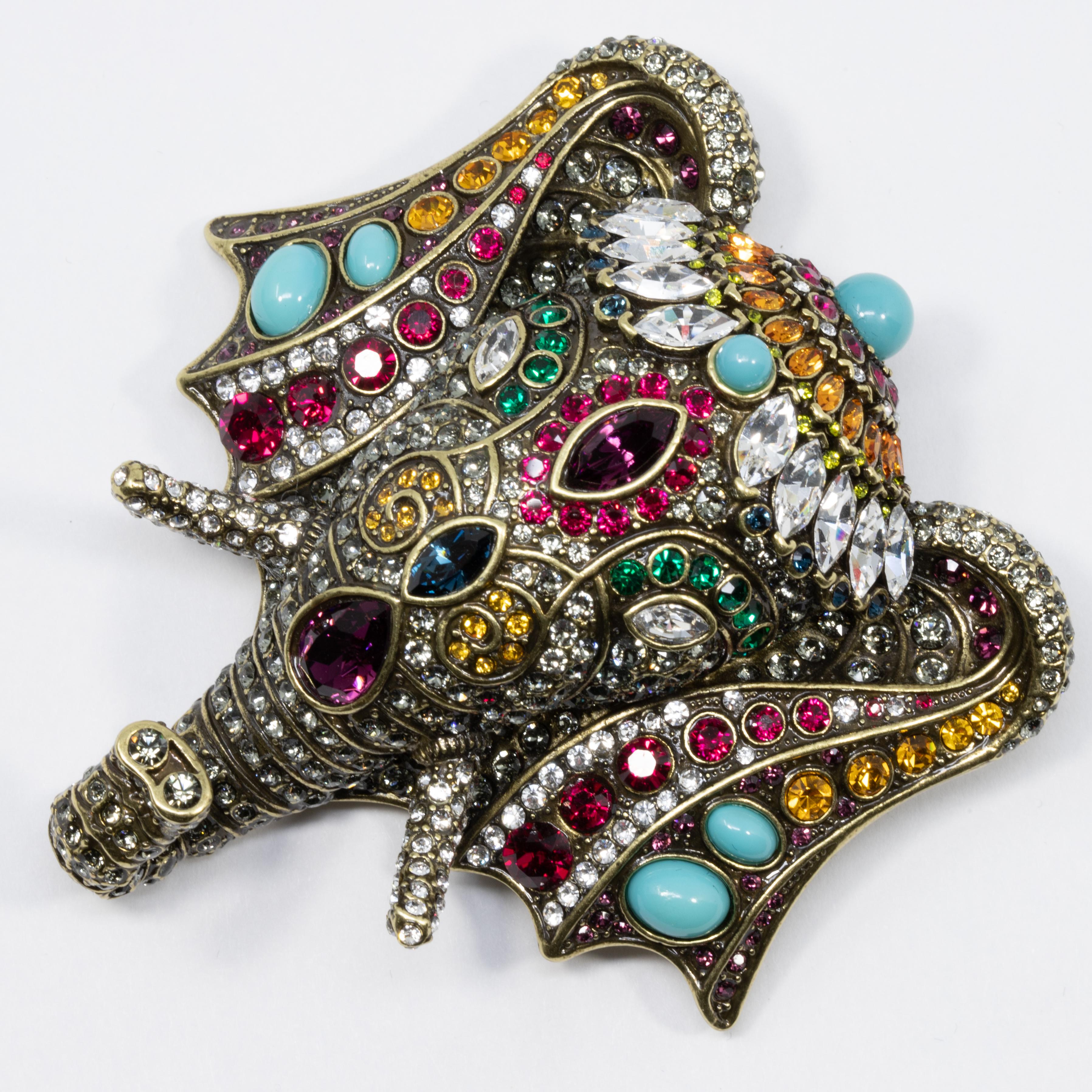 Chic Sheik elephant pin from Heidi Daus. This crystal-encrusted elephant head brooch adds an exotic touch to any style!

Limited-time, retired collection.

Hallmarks: Heidi Daus, CN