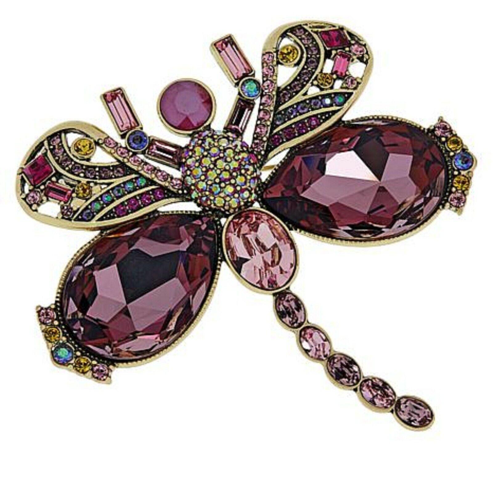 Critter craze! This jeweled interpretation of your favorite flying creature will set your heart aflutter. Pinned to your lapel, a pretty scarf or even your handbag, the whimsical demoiselle (dragonfly) design is sure to sparkle day or night.

Design