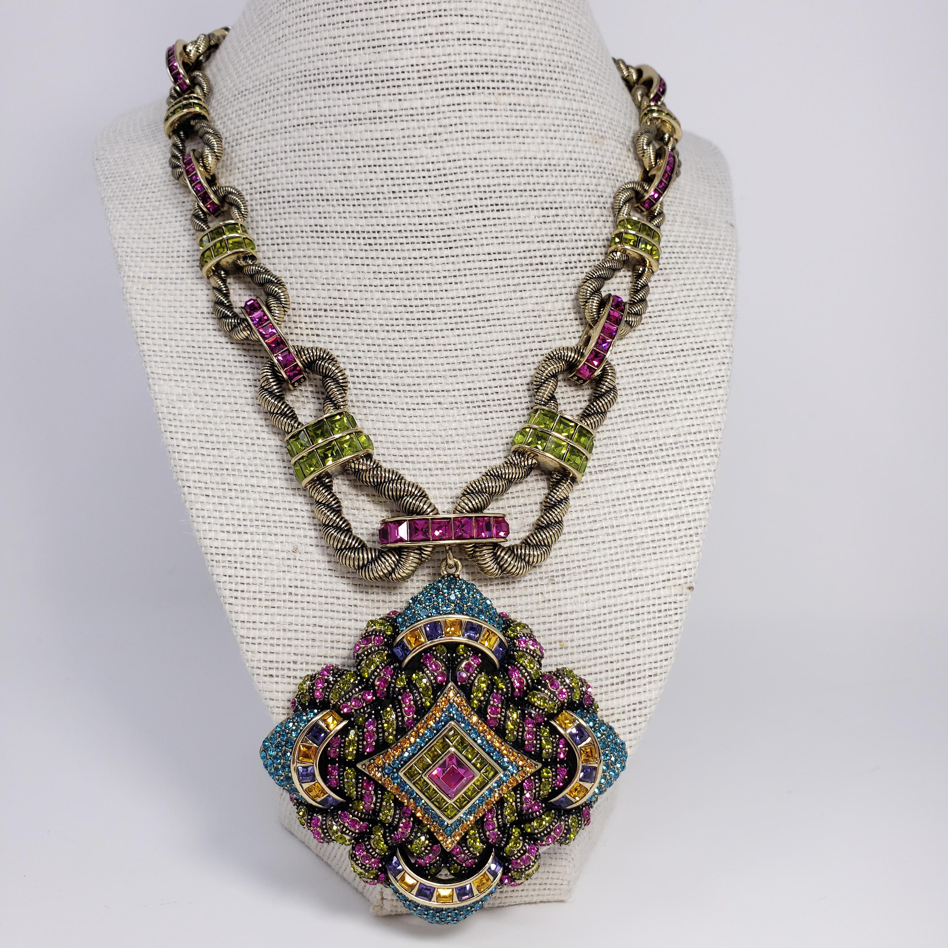 Heidi Daus ornate pendant necklace. Features large decorative pendant adorned with colorful crystals. Rope-motif link necklace.

From Heidi Daus' HSN collection.

Hallmarks: Heidi Daus, China

Pendant Dimensions: 7.5 cm / 3 in by 7.5 cm / 3