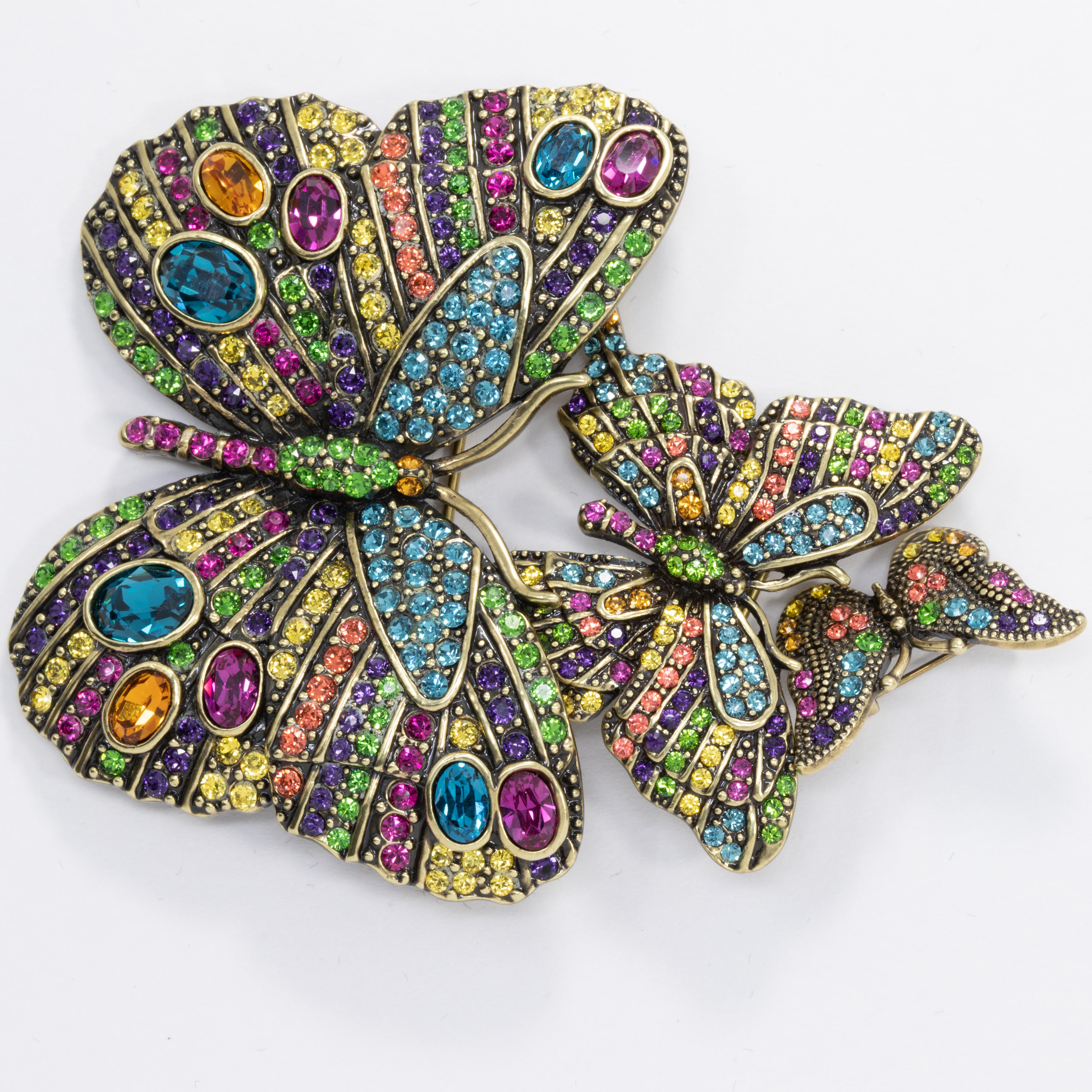 The Heidi Daus Fluttering Fantasy Crystal Pin Set will take your summertime style to new heights! This dazzling trio of butterflies rendered in show-stopping shades of multi colored crystal pavé, with larger crystals on the biggest pin, is the