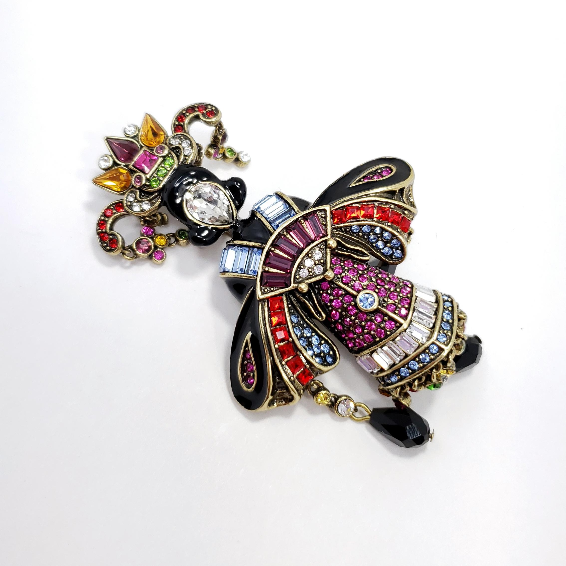 Entertain a new, more exotic look this season with Heidi's Geisha Glamour pin. Encrusted with sparkling crystals and dangling crystal charms, it will look perfect attached to that new kimono wrap you bought (or going to buy!).

Clear, light topaz-,