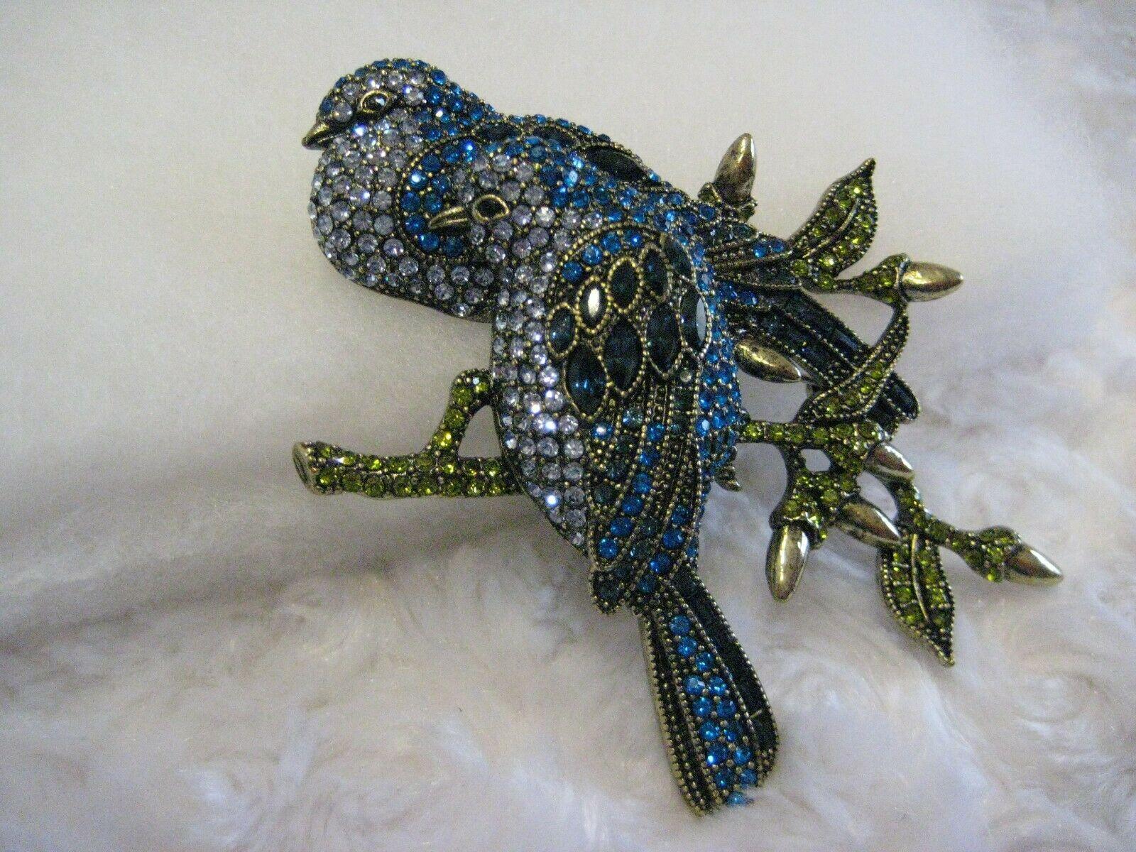 This darling pair of dazzling birds come fully decked in crystals.
Our Love Doves Crystal Pin is fitted with sapphire, Capri blue, and Montana crystal pavé, making these sweet birds the highlight of any ensemble they adorn.
Perched delicately on an