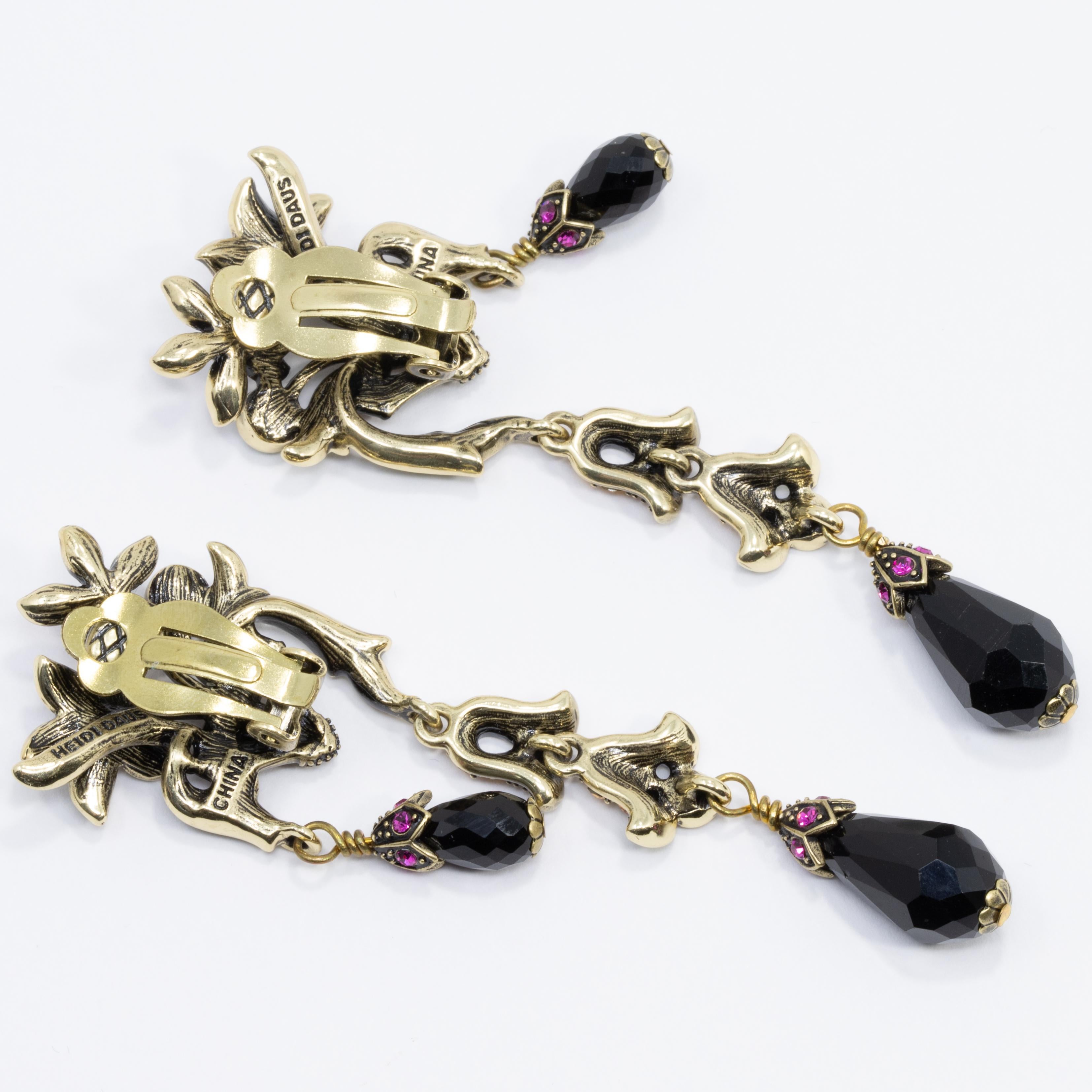 A garden of glamour! This is a fabulous dangle earring pair, featuring a bouquet of flowers in a basket. Two drops, short and long, dangle from the bottom of the basket and feature a faceted black jet briolette. Get the matching 'Perfect