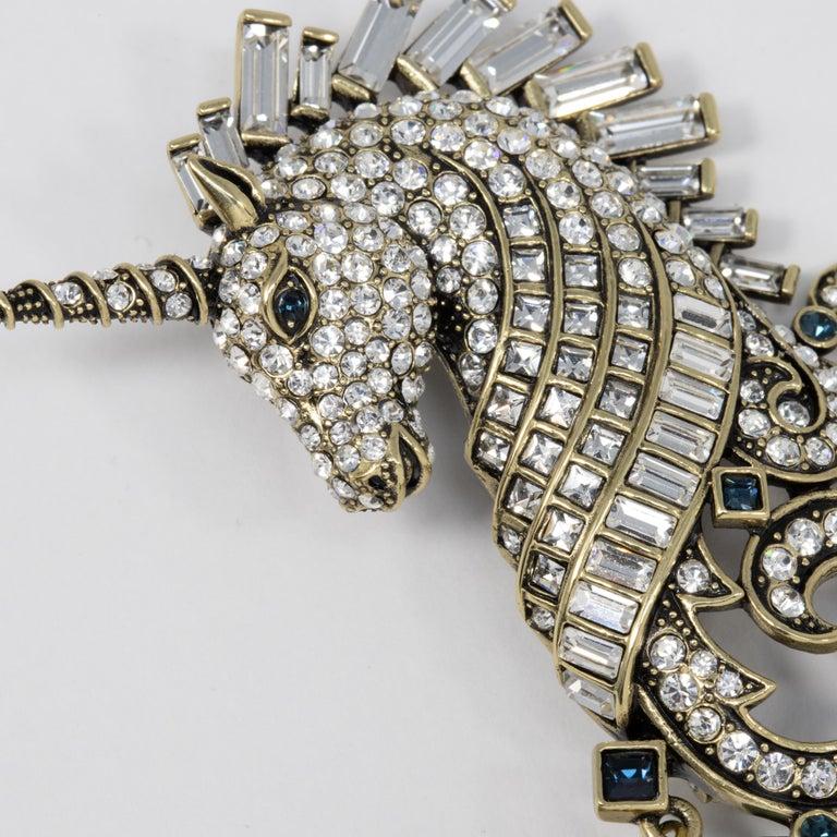 Chic and Dramatic, highly detailed Signed HEIDI DAUS Untamed Beauty Unicorn Designer brooch encrusted with pave-set sparkling round Crystals. Unicorn's mane set with crystal baguettes in semi-bezel settings and along border Bezel-set round and