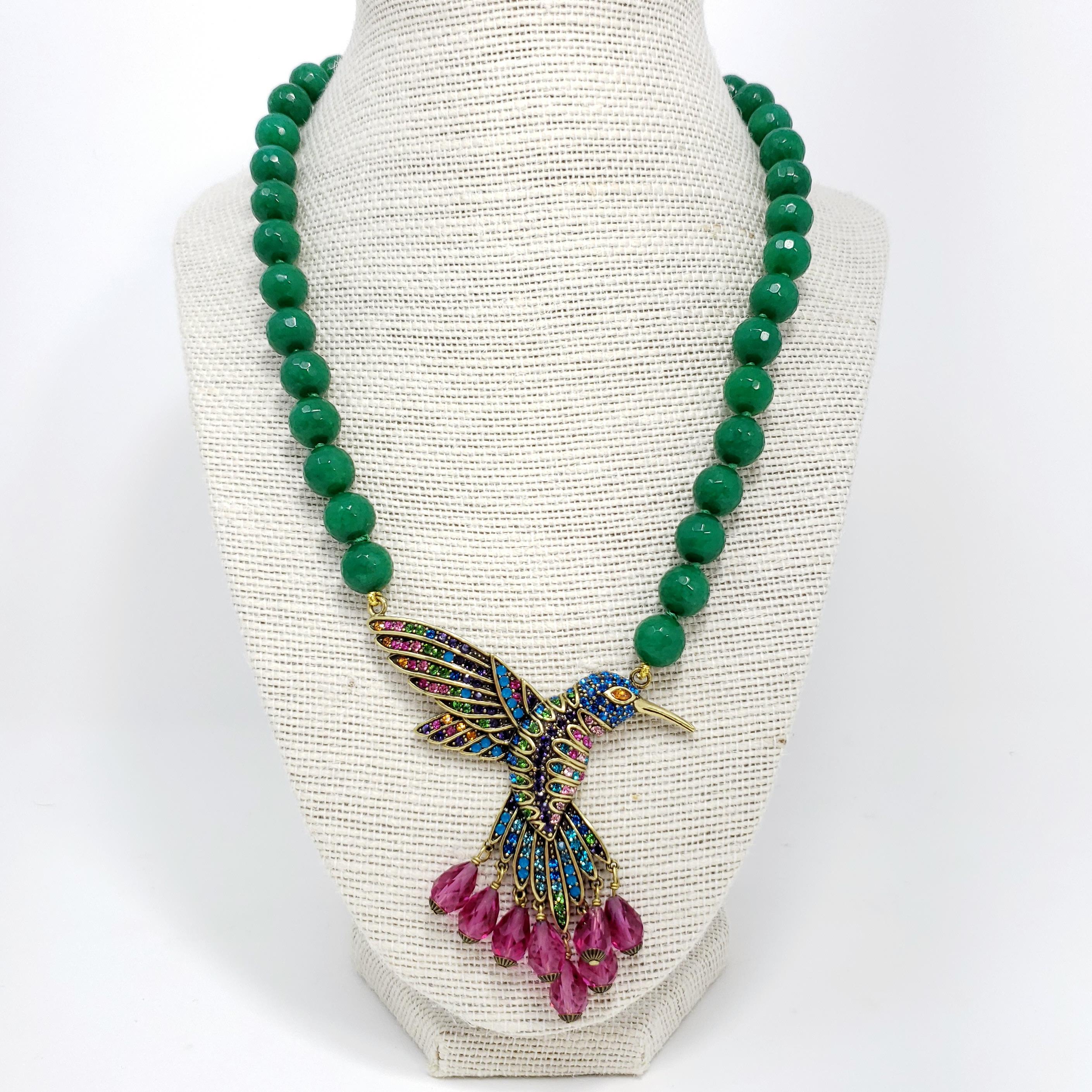 Soar to new heights of glamour. This enticing hummingbird design is covered from head to feathered tail in rich, sparkling crystal details. It's just what you need to get ahead of the fashion flock.

Single strand of individually knotted, smooth