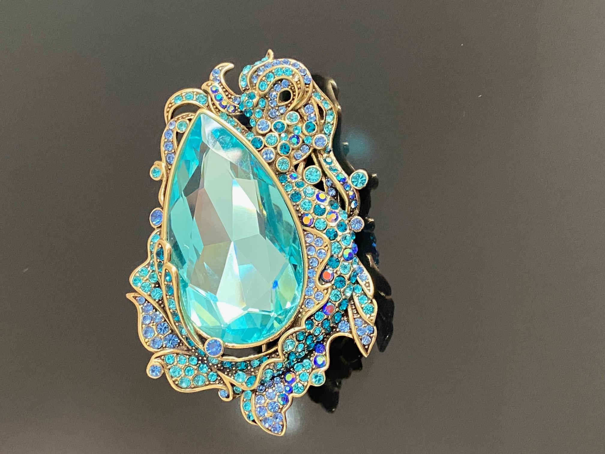 Heidi Daus Siren Of the Sea Crystal Brooch Pin

LISTING FOR PIN ONLY.

Let the sea set you free on Heidi's enchanting Siren Of Sea crystal Pin Brooch. Features a generously cut light Sapphire crystal surrounded by a decorative flourish od turquoise,