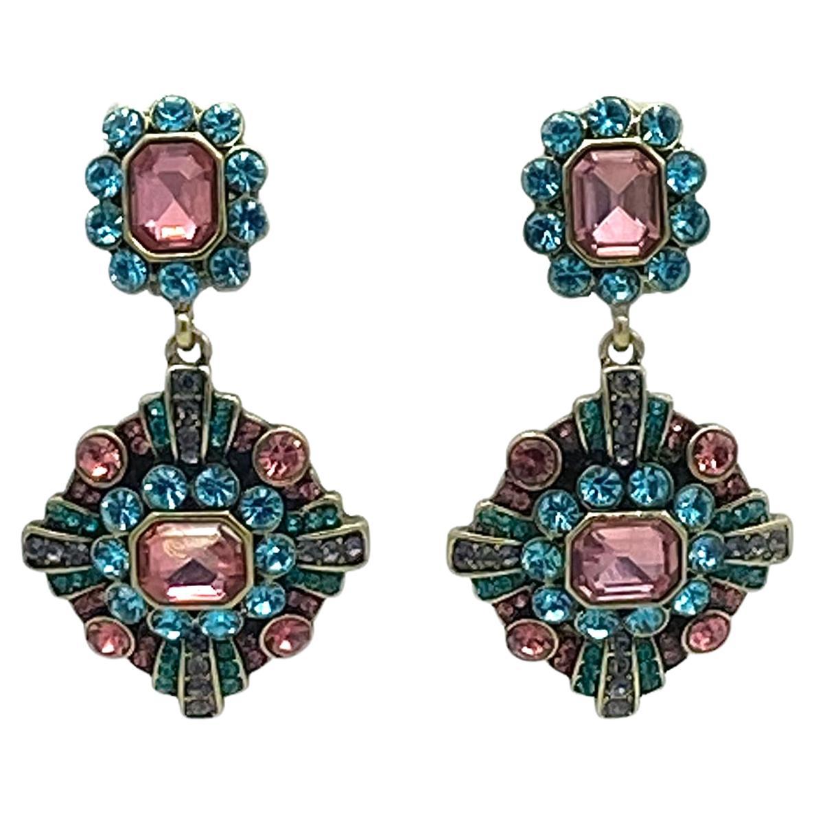 This is a pair of Heidi Daus statement drop earrings. They are Baroque style with fantastic Swarovski crystals set on bronze tone finished matrix. Heidi wants to ensure her jewelry lasts a lifetime.

Our vintage jewelry collection and original