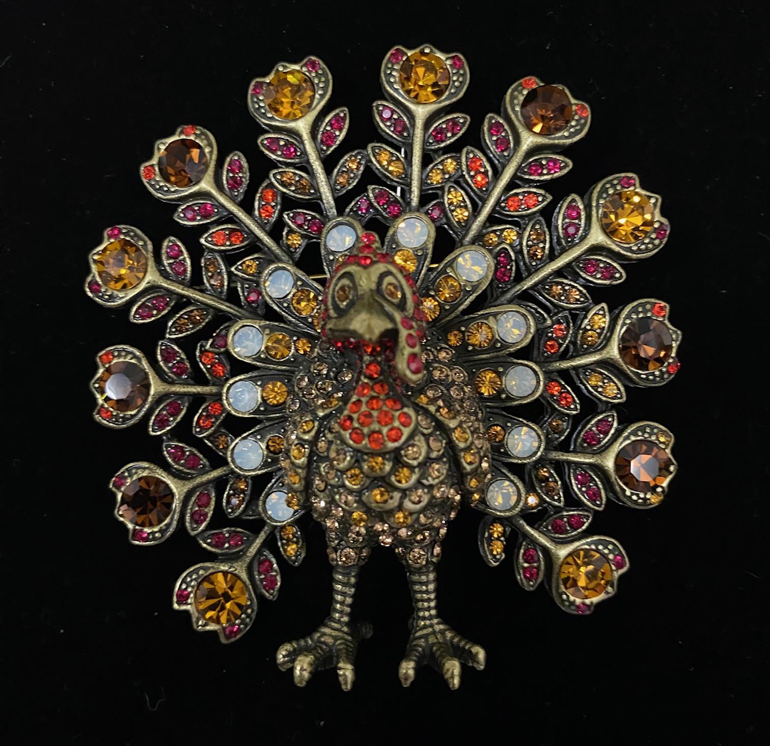 Gobble up this holiday feast of sparkle. Attached to your favorite fall scarf, pinned on an oversized lapel, or even used as a glamorous table decoration for the big feast, this whimsical Tom Turkey pin is sure to impress.

Design