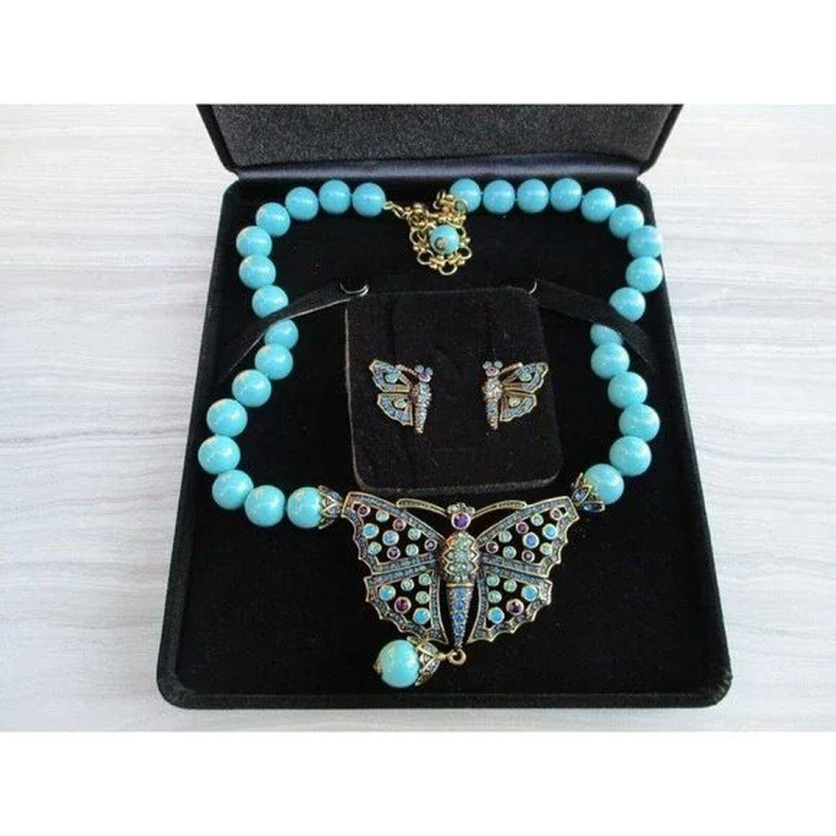 Simply Beautiful! Designer Heidi Daus Monarch Madness Butterfly Necklace and Earring Set. Beautiful bronze/gold tone butterfly embellished with various blue and purple Swarovski crystals, suspended from a faux Turquoise Bead Necklace. Fun and