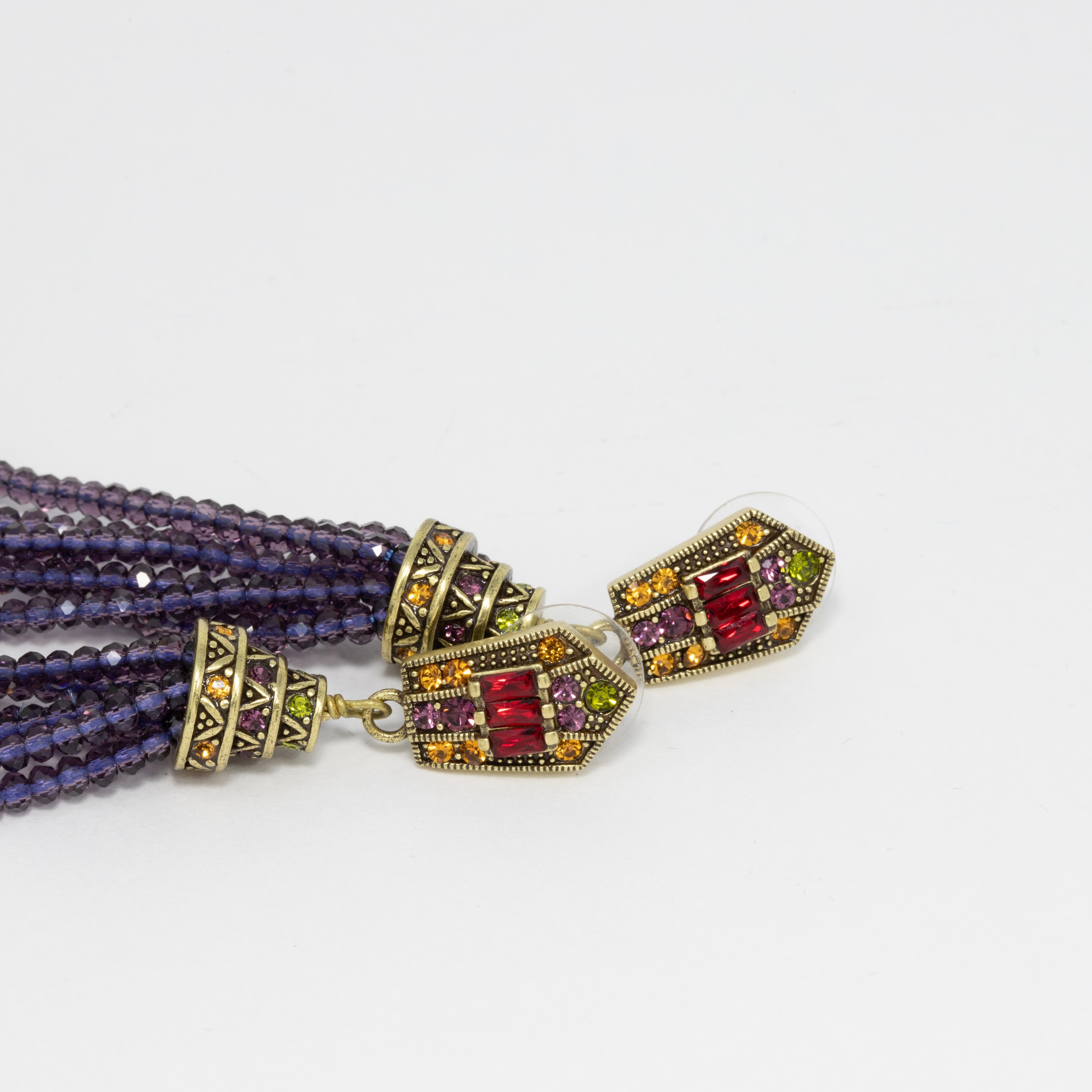 Embellished dangling post-back earrings by Heidi Daus. Feature ruby red and citrine crystal tops with dangling purple and green crystal tassels.

Hallmarks: Heidi Daus, China

