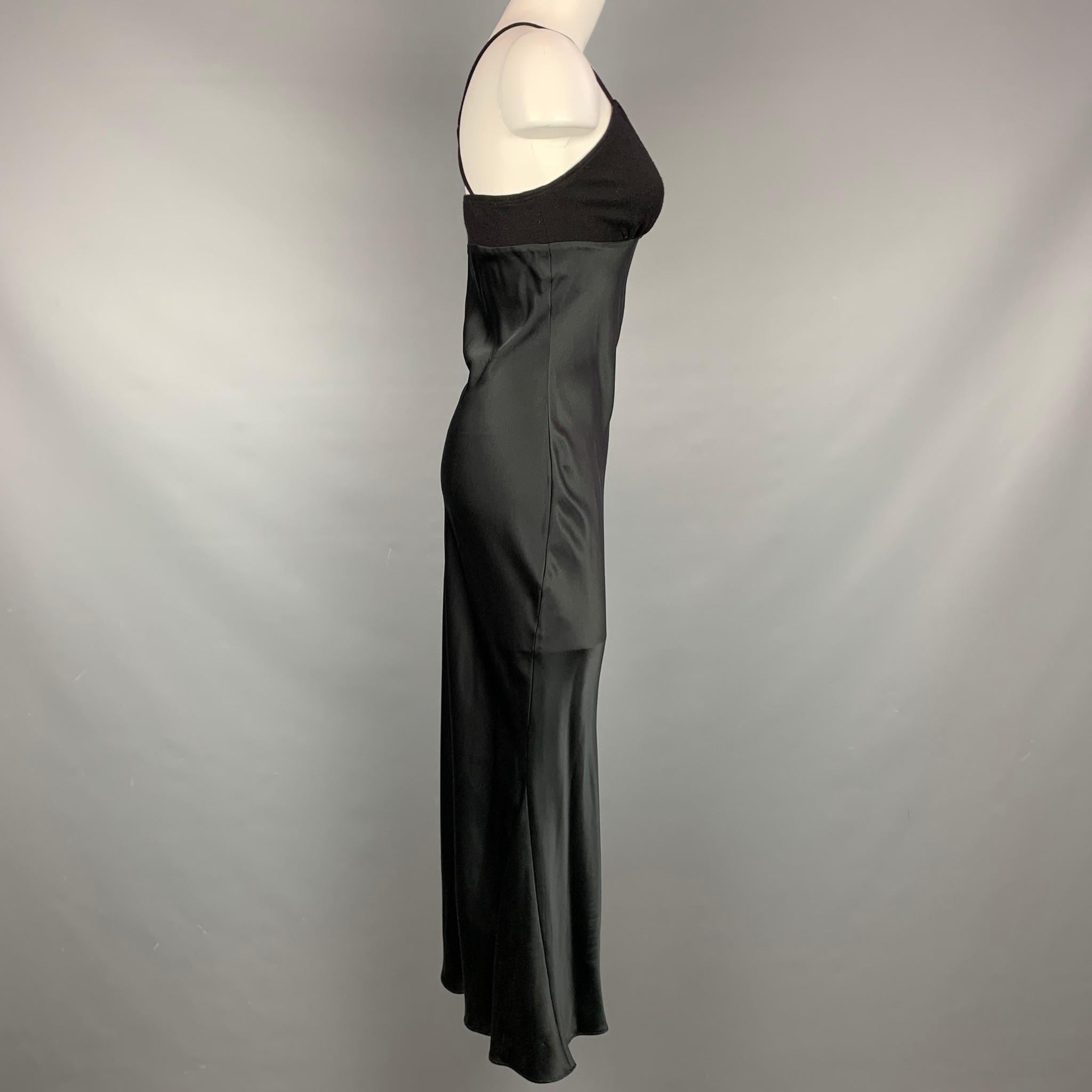 HEIDI WEISEL long dress comes in a black satin silk featuring a knitted top and spaghetti straps. 

Very Good Pre-Owned Condition.
Marked: 4

Measurements:

Bust: 26 in.
Waist: 28 in.
Hip: 32 in.
Length: 47 in. 