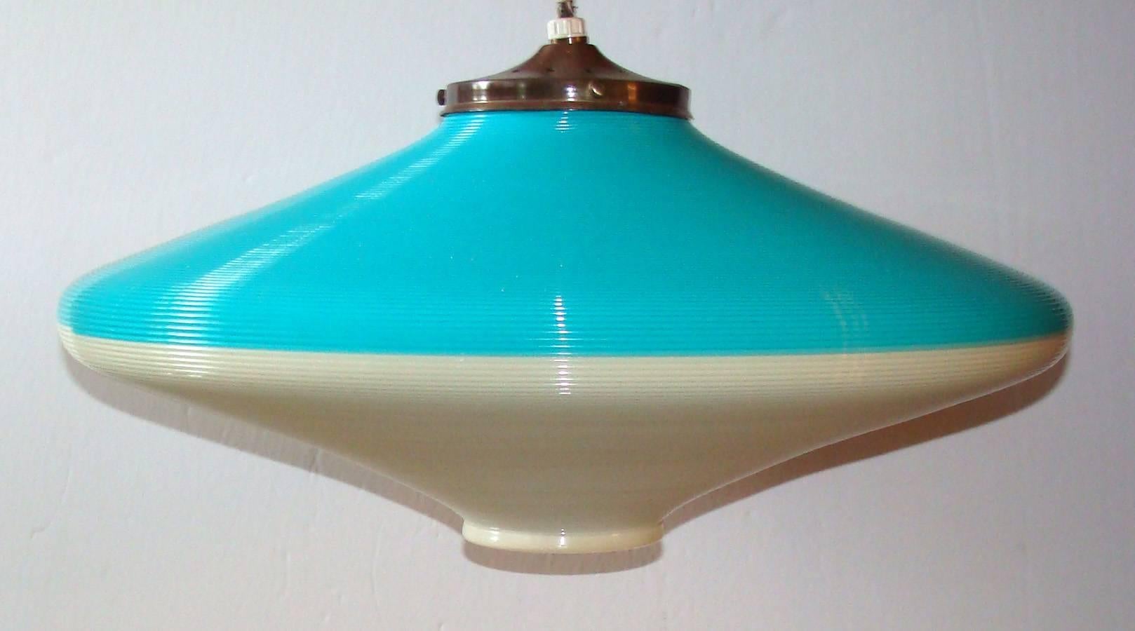 Large 19-inch  Rotaflex hanging fixture in a vibrant two-tone Turquoise and warm white.  Fine original condition including original brass cap.
No chips or cracks.  Needs simple cord replacement.

Initially developed in Europe early 1950's by ARP