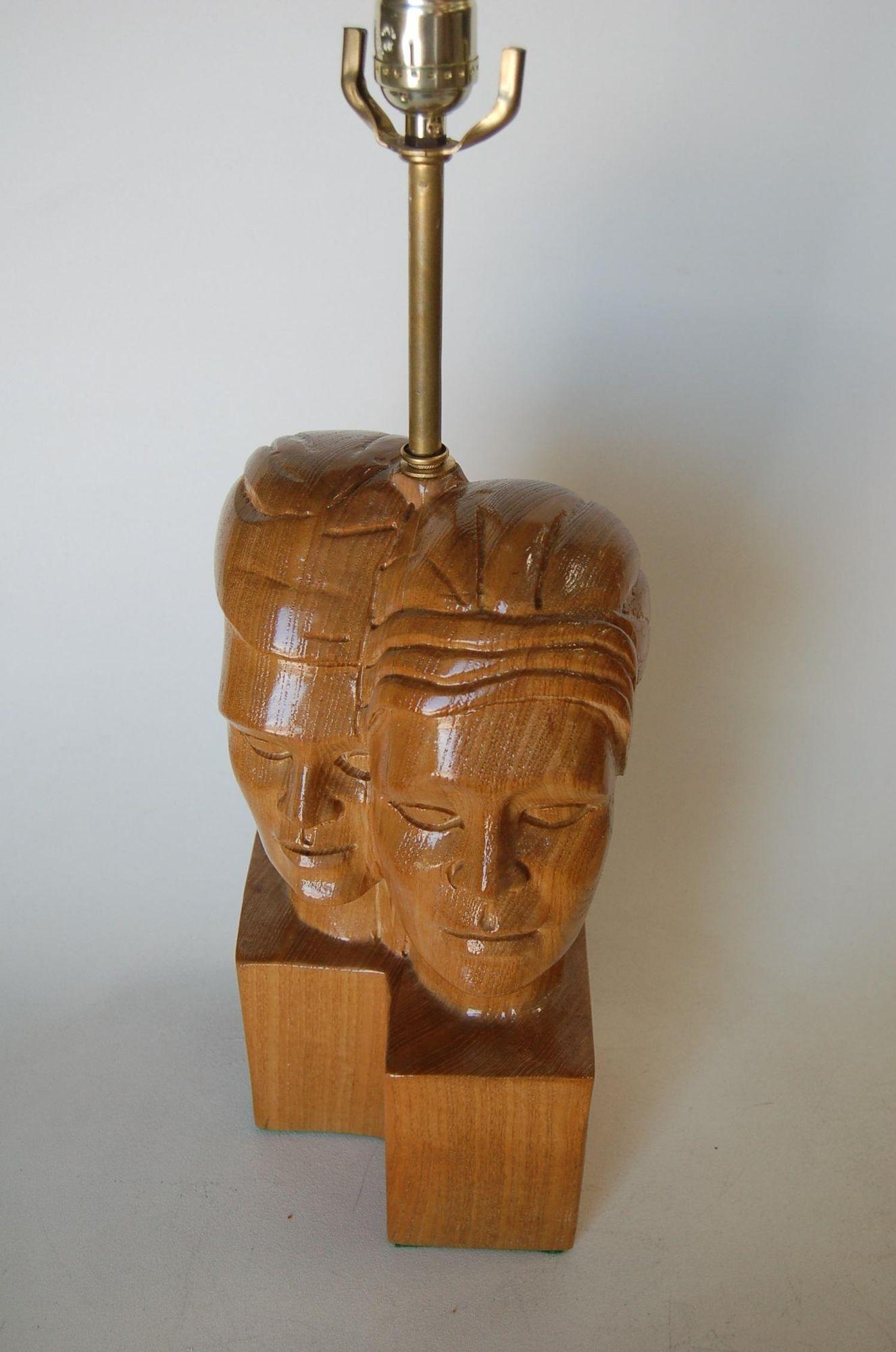Circa 1950 Mid Century carved oak side male and female couple table lamp pair In the style of Jascha Heifetz.

Measures 22
