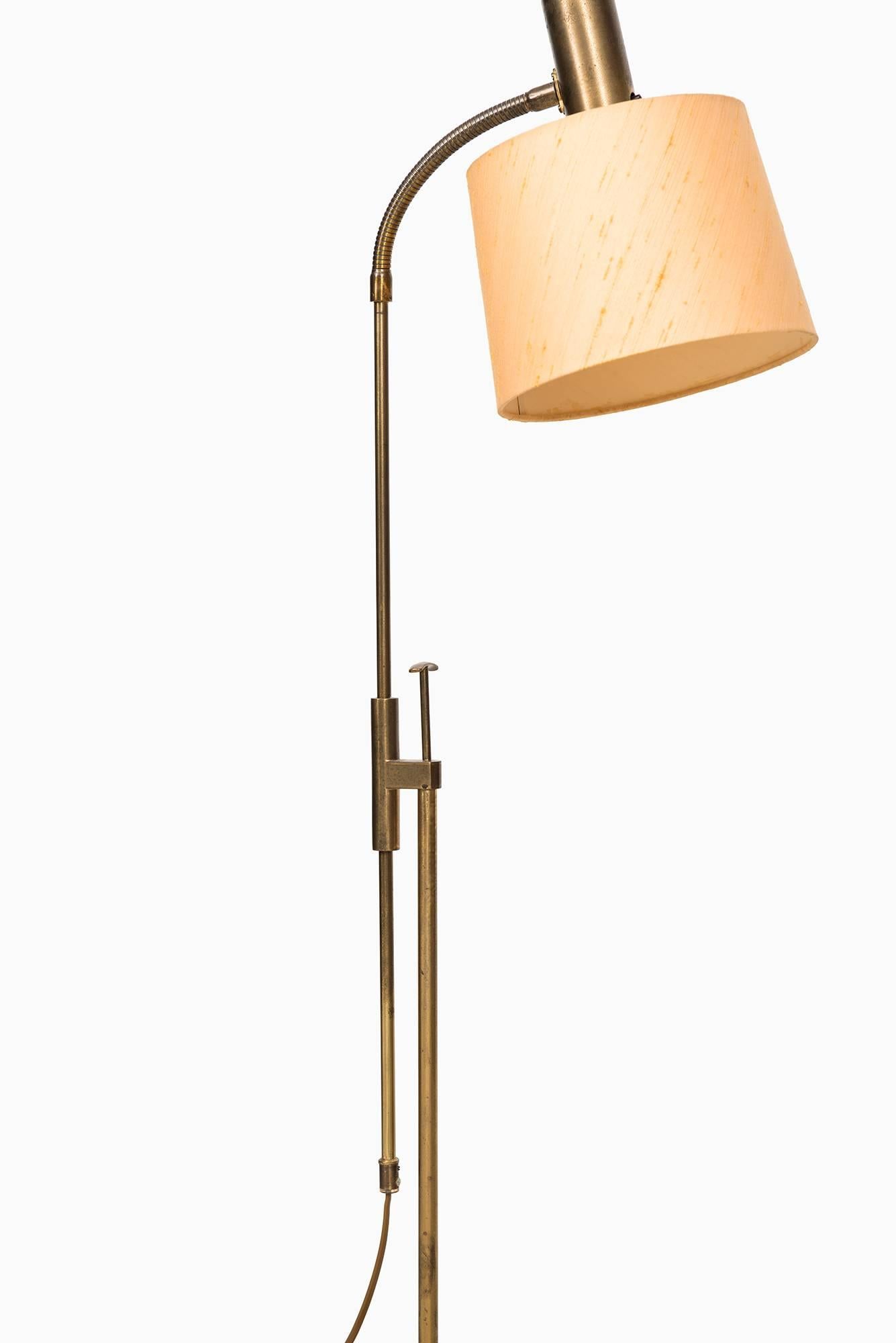 Height adjustable floor lamp. Produced by Falkenbergs Belysning in Sweden.