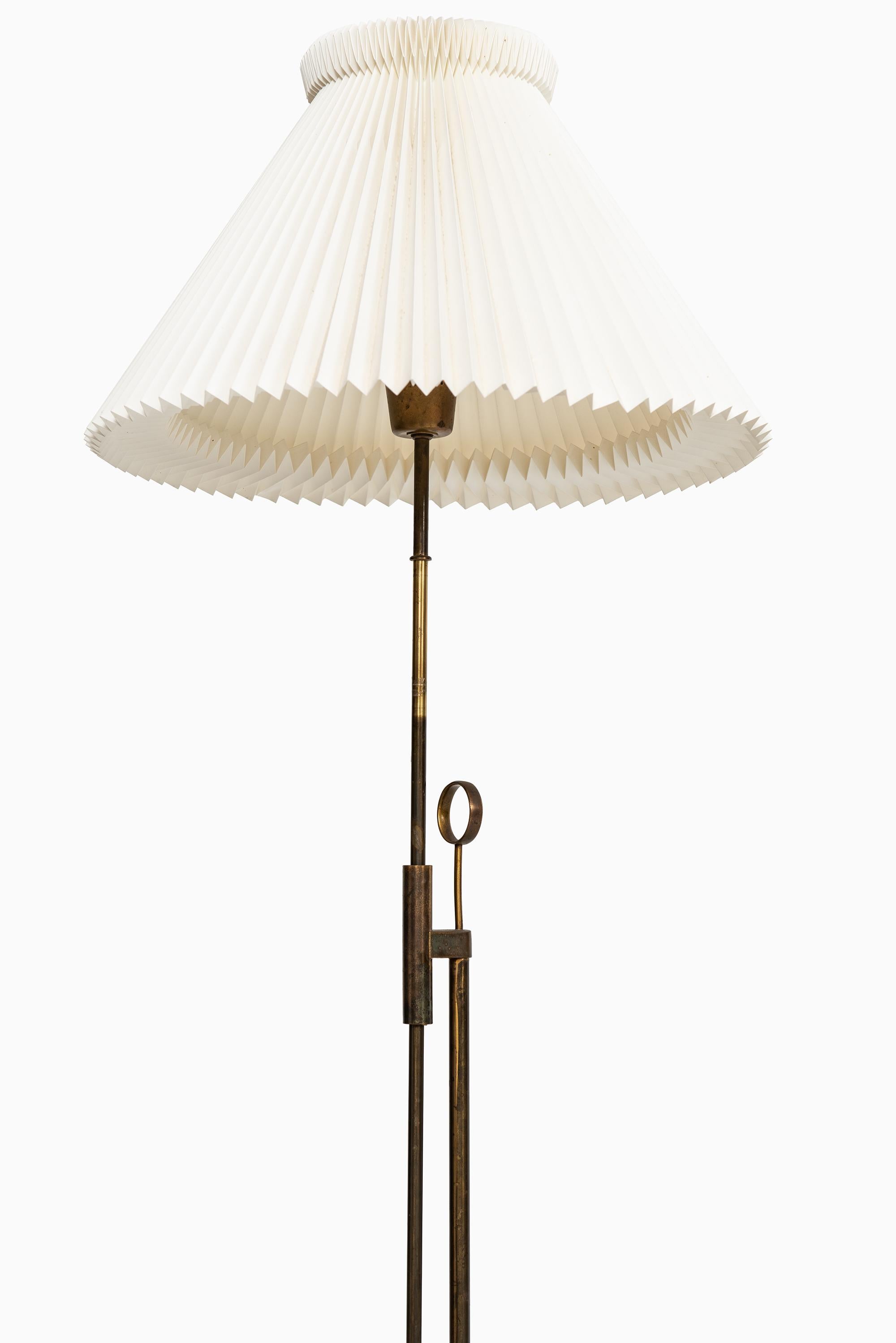 Height adjustable floor lamp in brass. Produced by Falkenbergs Belysning in Sweden. Dimensions as photographed (W x D x H): 44 x 44 x 132-175 cm.