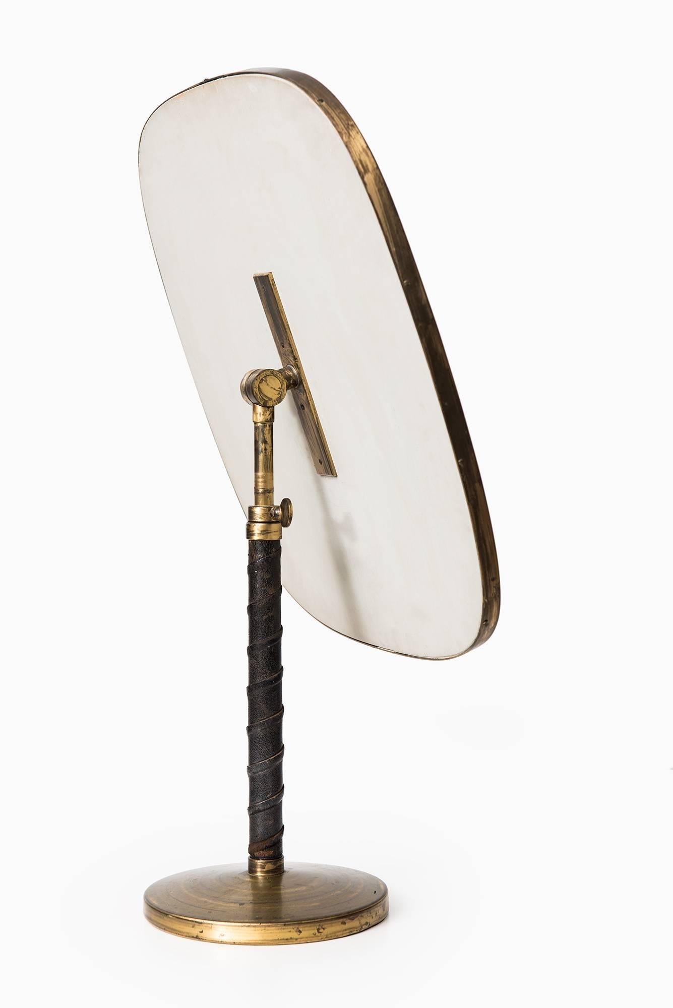Rare height adjustable table mirror attributed to Josef Frank. Produced by Nordiska Kompaniet in Sweden.