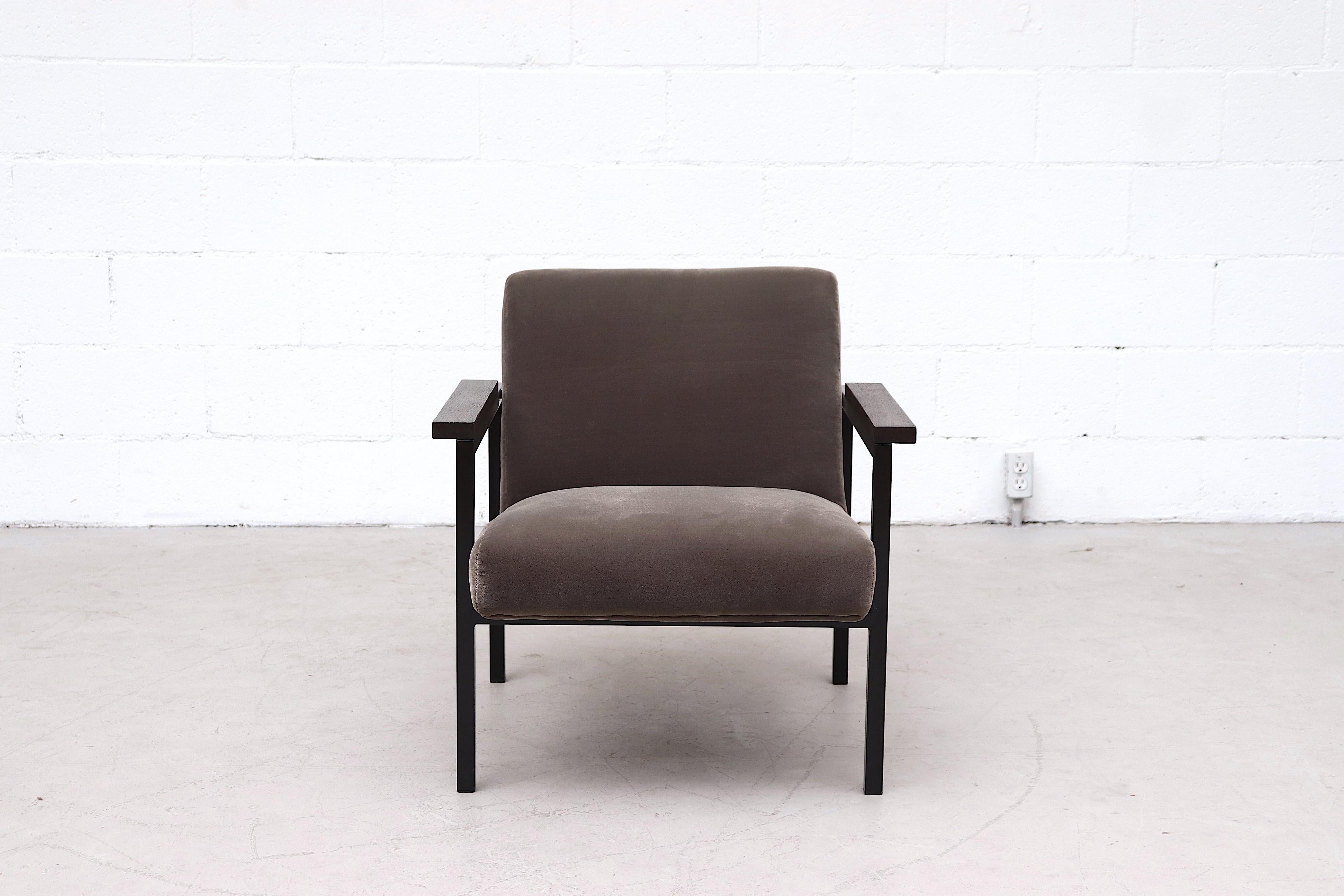 Hein Stolle attributed lounge chair with newly upholstered charcoal velvet on a black enameled metal frame with lightly refinished dark wenge arm rests. In good overall condition with original frame.