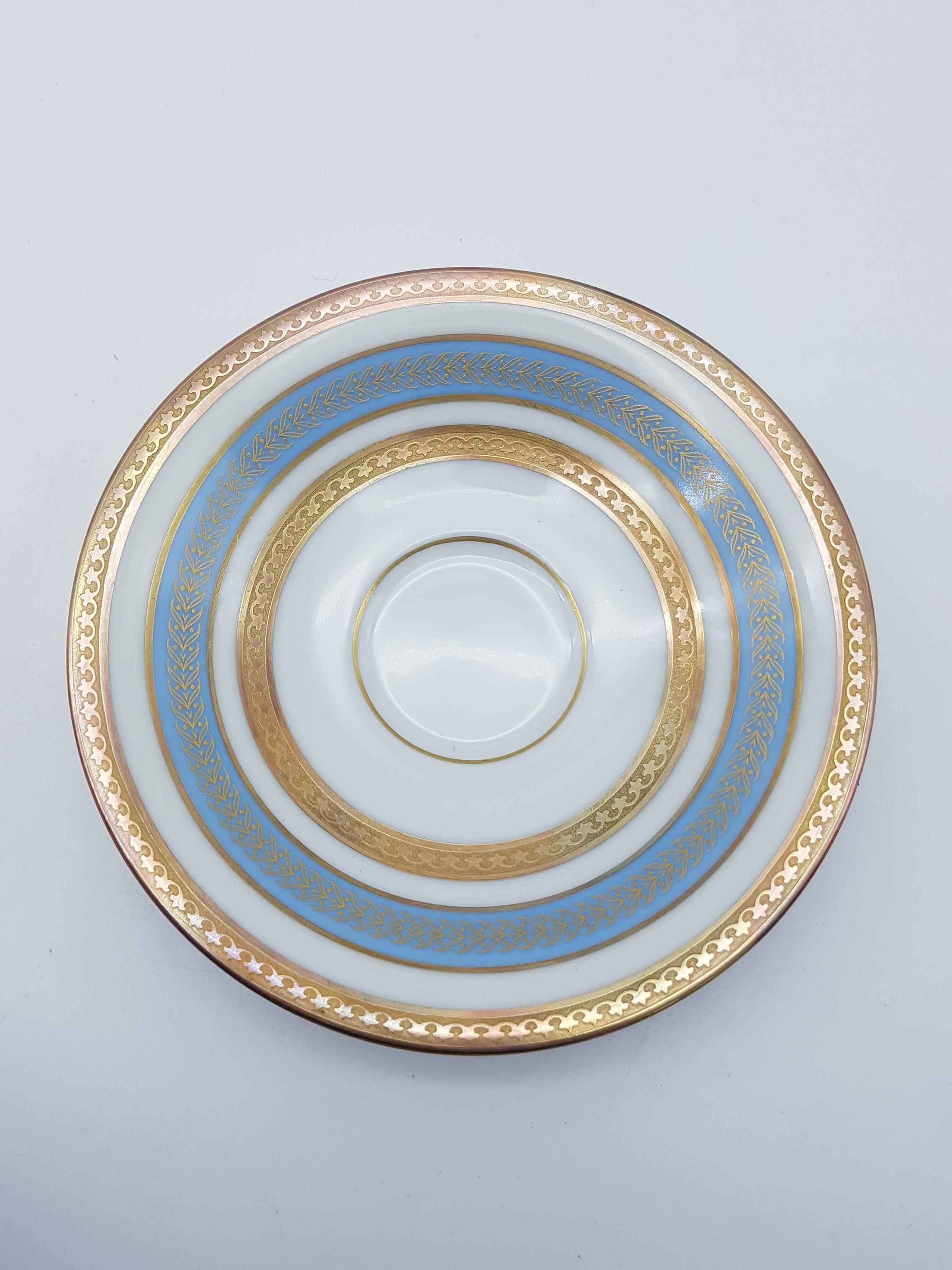 Beautiful set of 12-piece coffee-service, manufactured in Germany by Heinrich & Co, circa 1960s-1970s. The service consists of 6x tea-cups and 6x saucers. All pieces are delicately decorated with a gold rim and a turquoise / sky blue band. No chip
