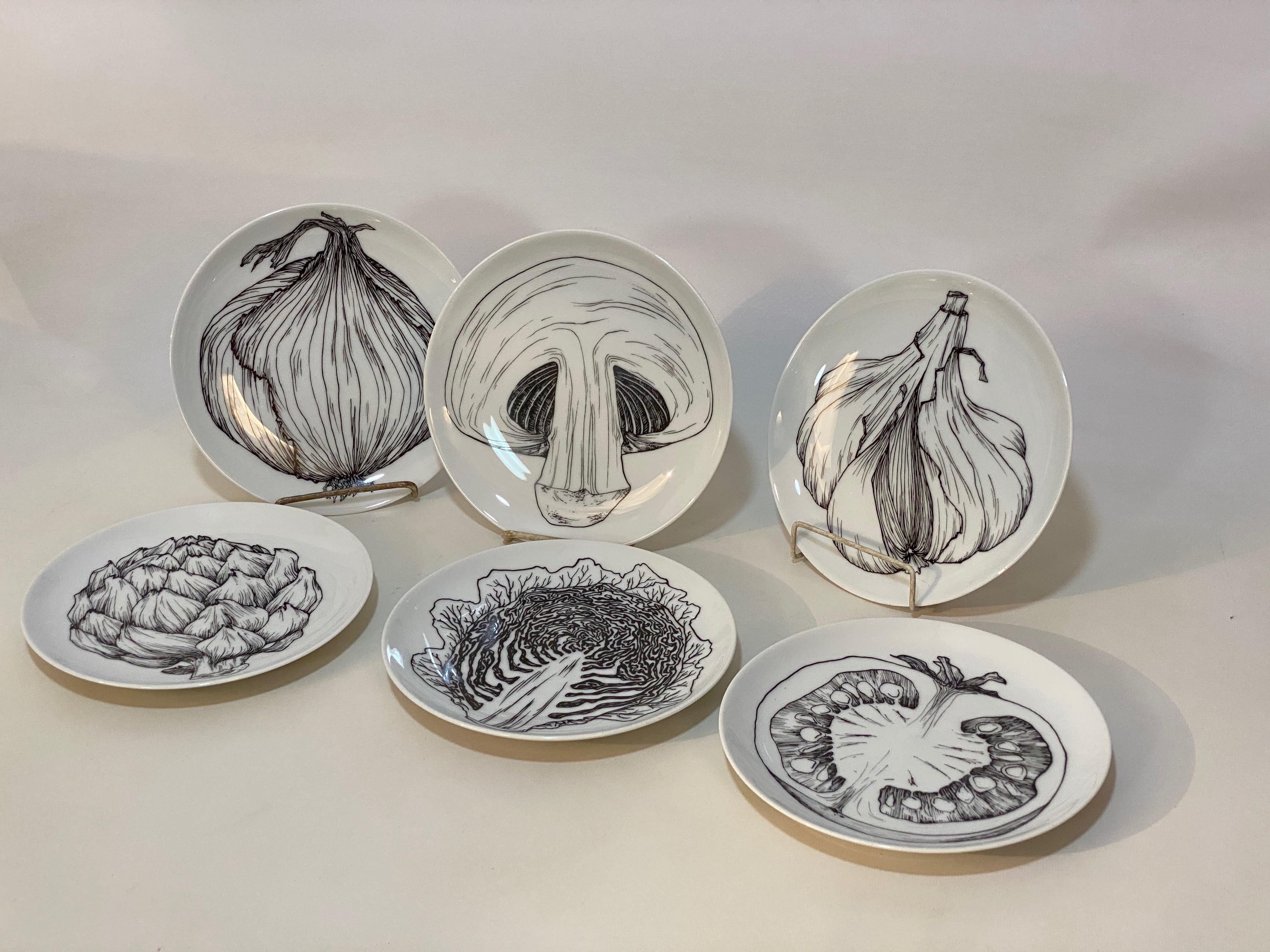 Fine Bavarian porcelain salad or dessert plates. Fully signed on the reverse H & Co, Selb, Bavaria, Germany, Heinrich. black and white graphic design on each unique plate. Screen printed graphics depict garlic, onion, asparagus, cabbage, mushroom