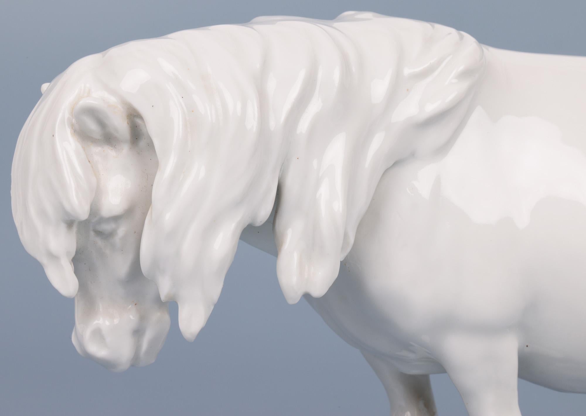 A fine German Meissen mid-century porcelain blanc de chine figure of a Shetland pony designed by German sculptor and illustrator Heinrich Drake (Germany, 1903-1994). The pony is well modelled standing on four legs long bushy tail and main and well