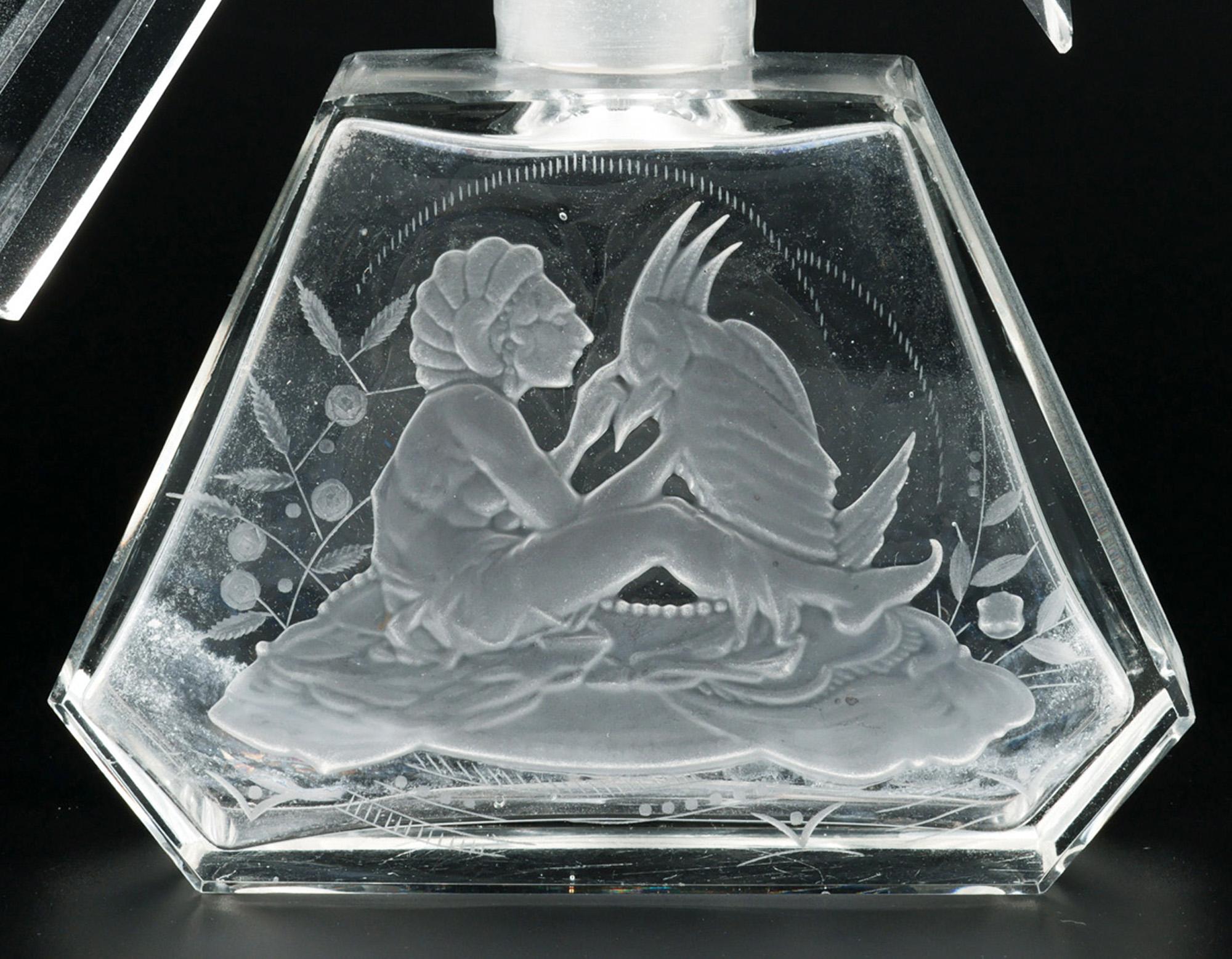 A very fine and unusual Art Deco Czech Parrot glass perfume bottle engraved with a nude and Parrot by renowned glass maker Heinrich Hoffmann (1875-1939) and dating from around 1920’s.
Heinrich Hoffmann was a prominent producer of luxury glassware