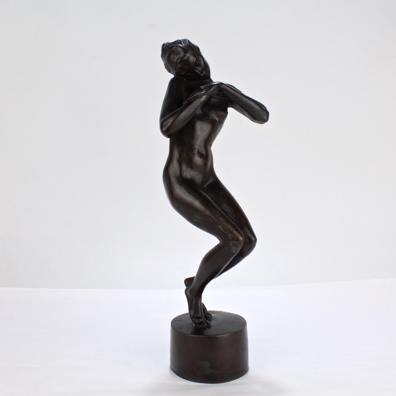 A wonderful, signed model of an nude dancer by Heinrich Karl Scholz.

Simply a lovely representation of femininity and vitality!

The sculpture is art historically interesting in that it's positioned on right on the cusp of the transition from