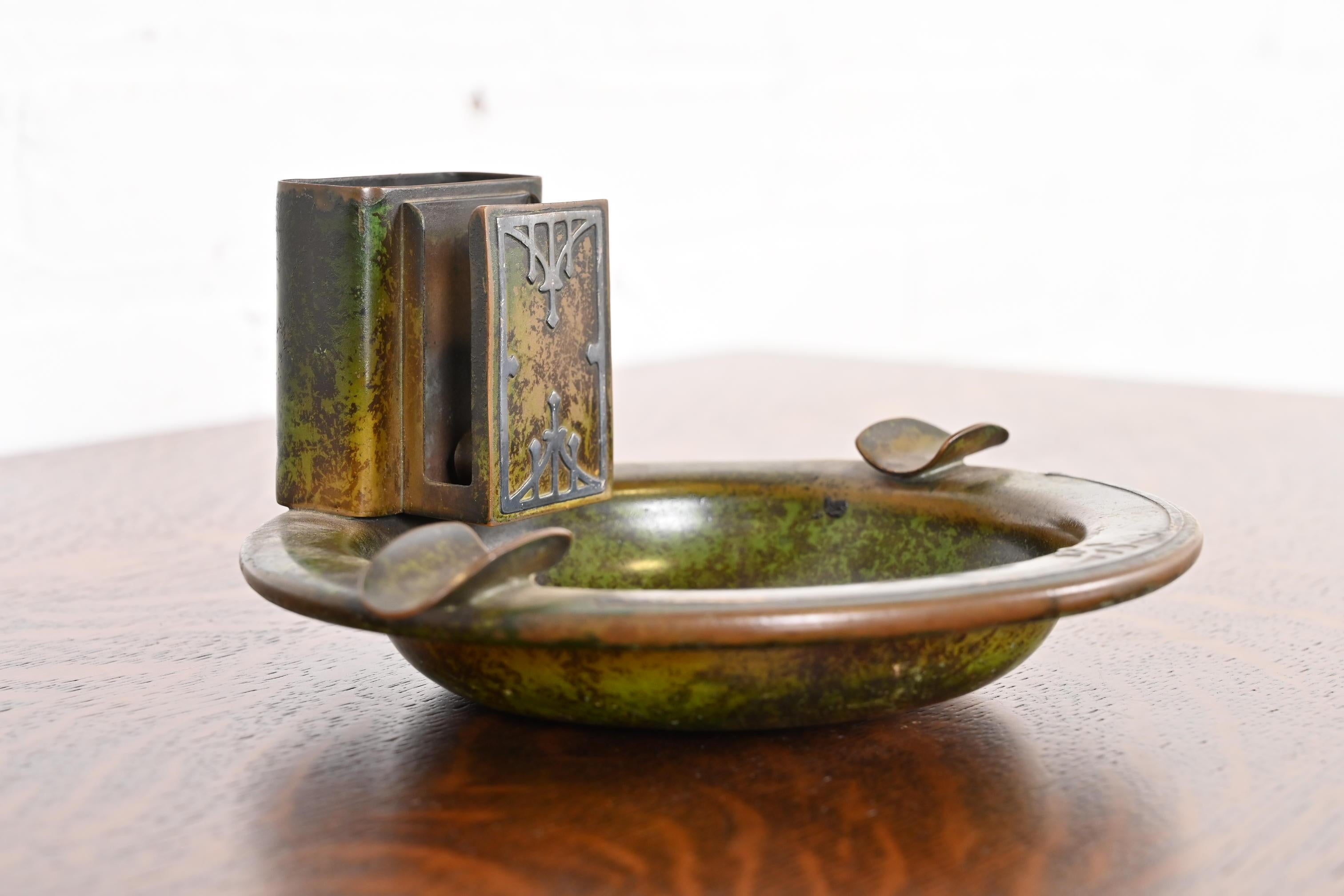A beautiful Arts & Crafts or Art Deco period sterling silver on bronze ashtray with verdigris green patina

By Heintz Art Metal Shop (signed to the underside)

USA, Early 20th Century

Measures: 8