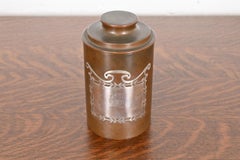 Boîte ou récipient à cigarettes ronde Heintz Arts & Crafts en argent sterling sur bronze