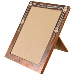 Cornice Heintz Smaco Arts & Crafts in argento e bronzo, anni '20