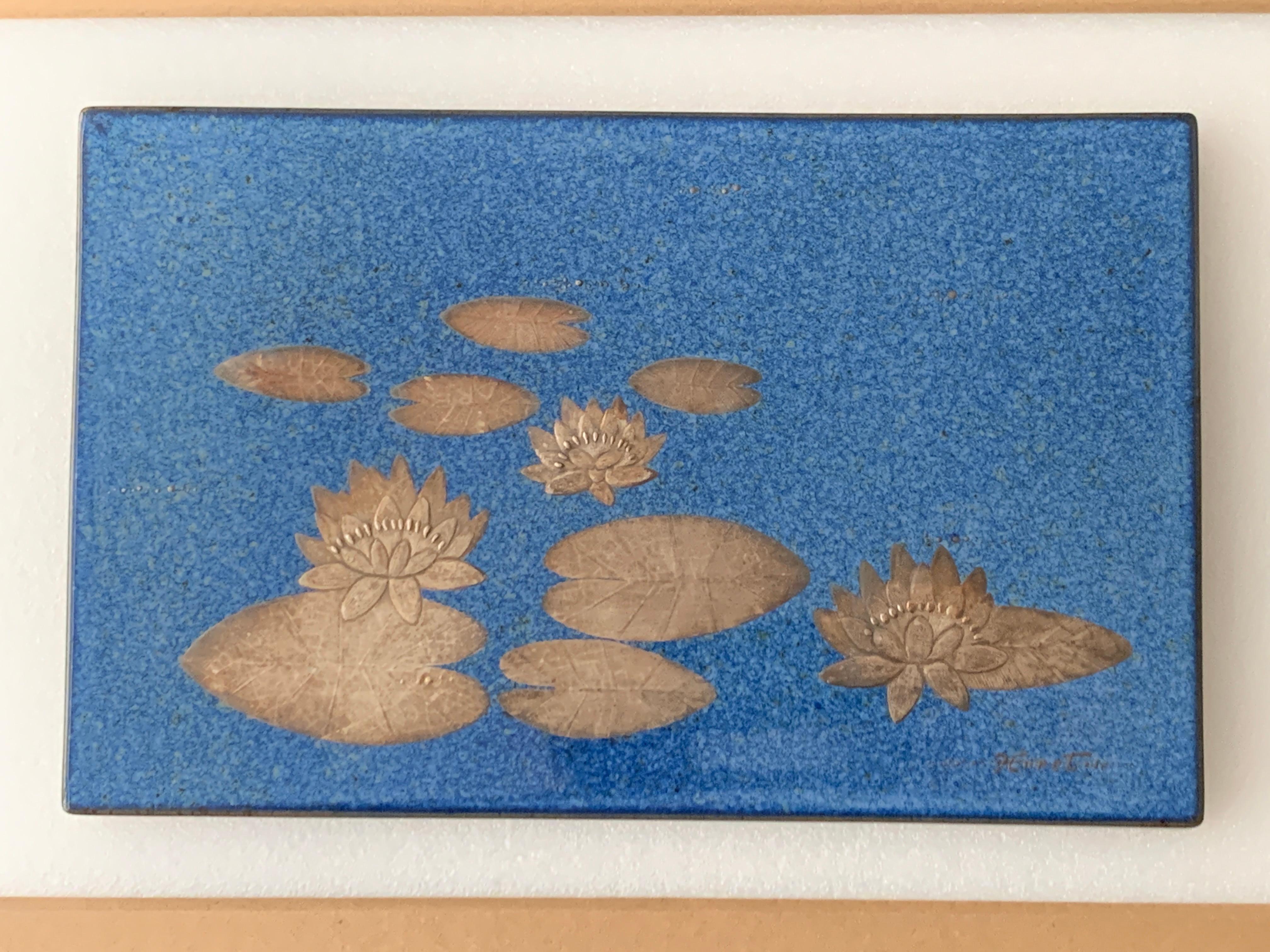 Heinz Erret (Swedish, 1920-2003), Heinz Erret Klosterberget hand painted rectangular wall relief with dark blue glaze and water lilies in genuine precious silver metal relief, signed to lower right. Stamped to reverse for Klosterberget, Värmdö –