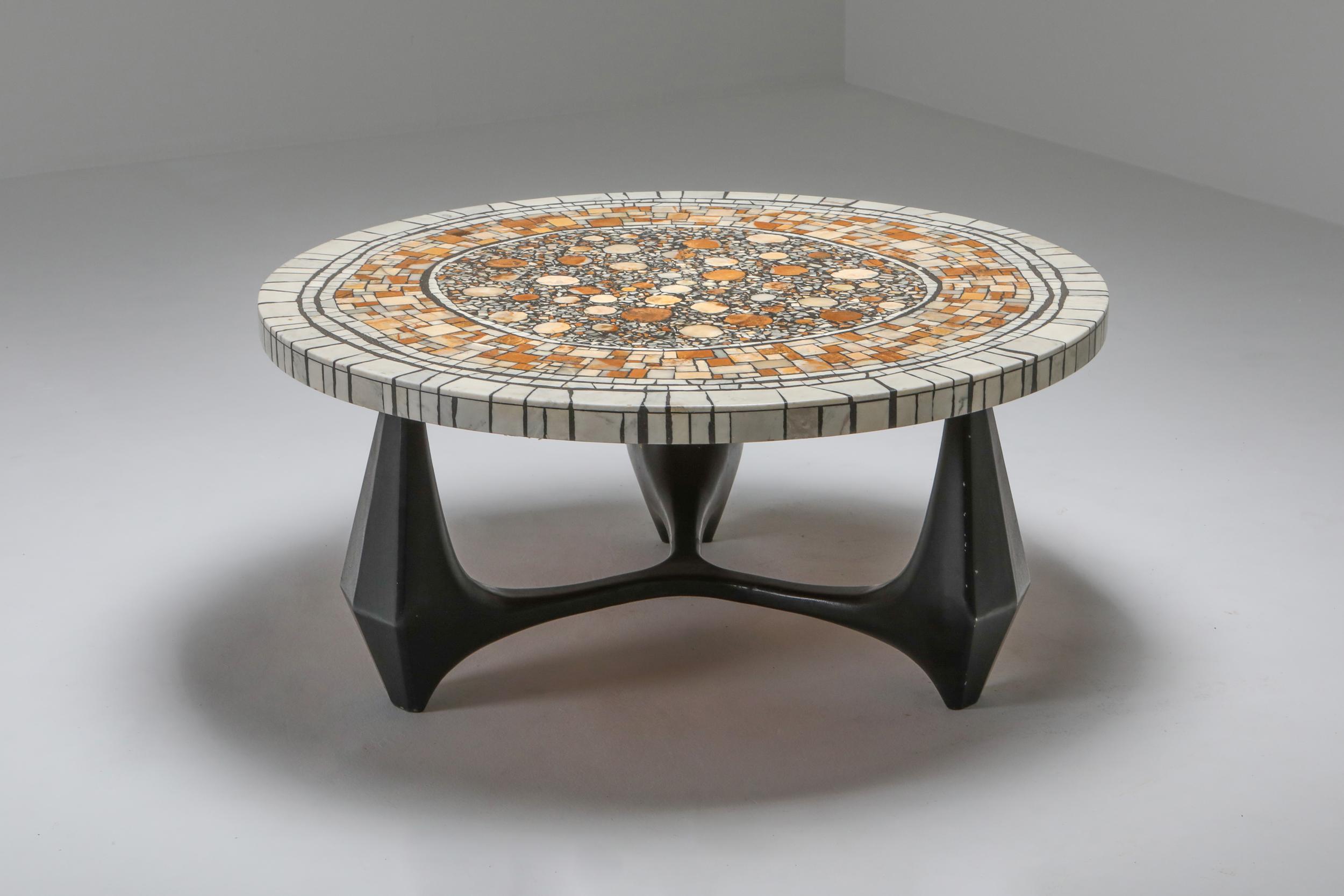 Brutalist coffee table model Chartre, Heinz Lilienthal werkstatten, 1973 Germany

Stunning coffee table from the same era and style of Roger Capron and Pia Manu.
Black aluminium frame, marble stone mosaic table top
Great use of colors throughout