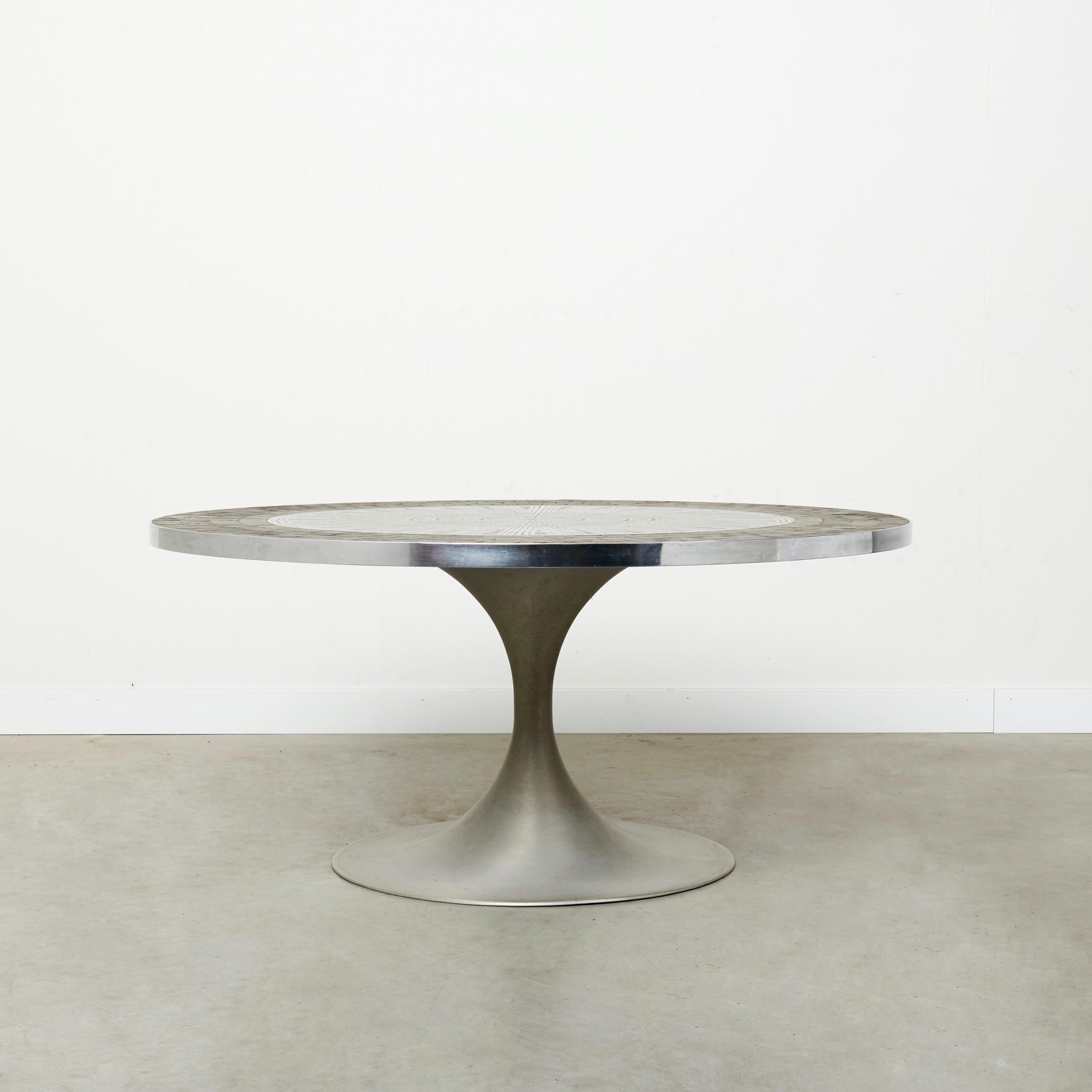 Mid Century coffee table by Heinz Lilienthal, Germany 1970s.
Mosaic slate stone and aluminium table top. Steel base.
Table is in a good vintage condition. Base and table top with patina and signs of use like small scratches and stains.