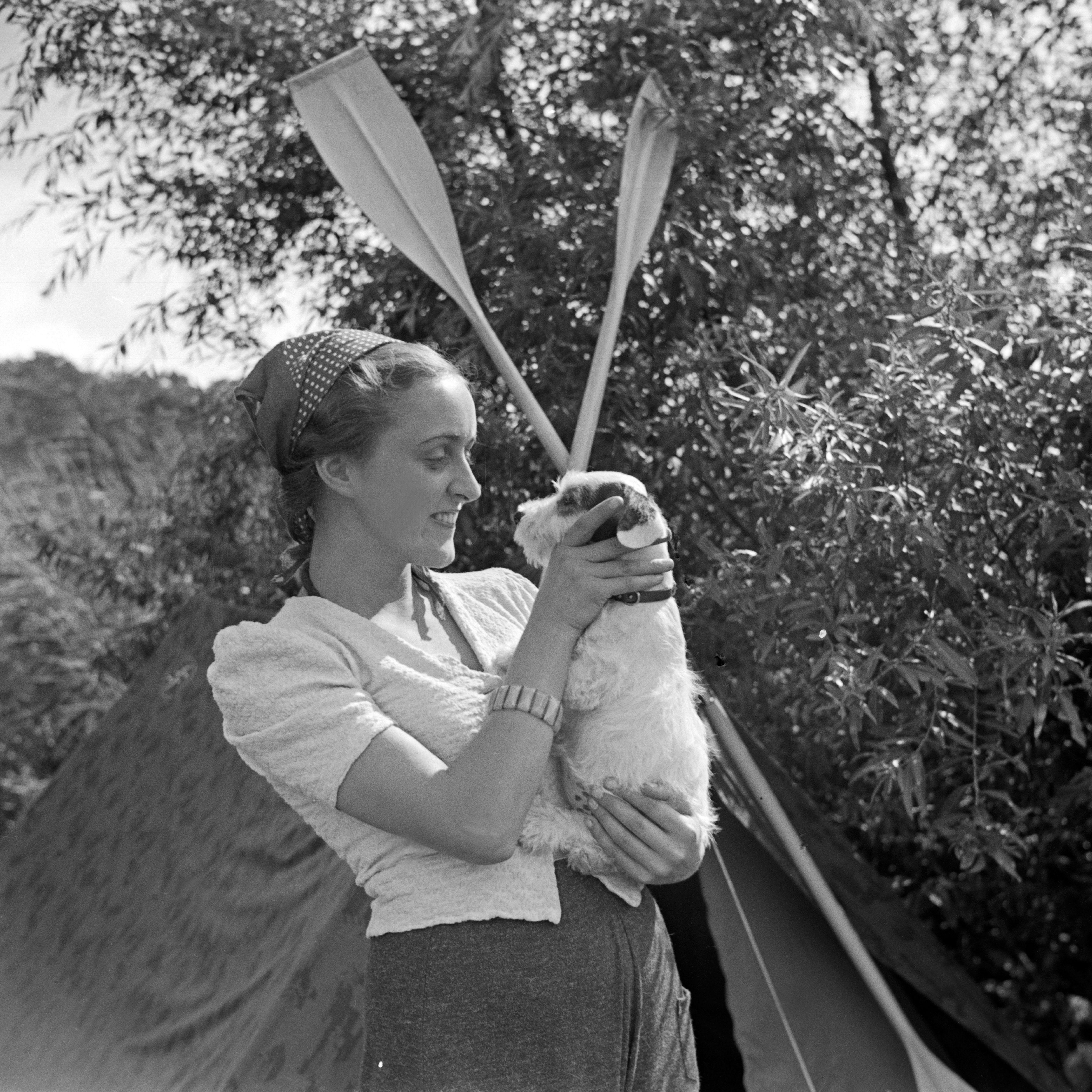 Woman and dog in summer - 1930s - Photograph by Heinz Pollmann