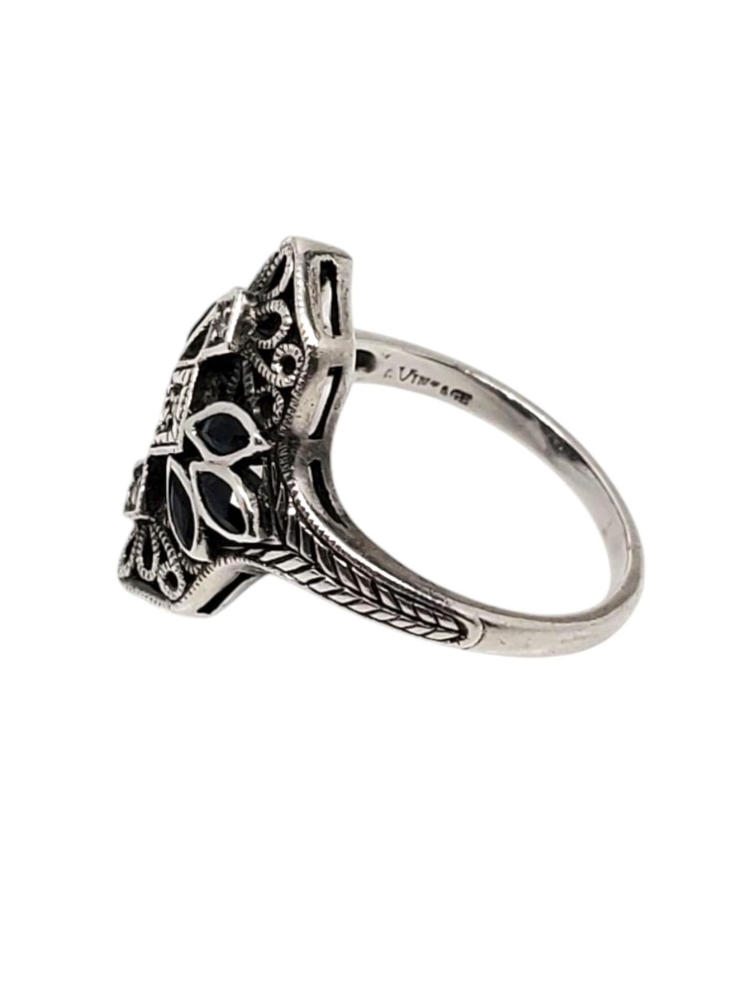 Heirloom 73 Sterling Silver Sapphire & Diamond Filigree Ring -

This vintage art deco ring features 6 sapphires 3 diamonds an is set in a sterling silver filigree design by Heirloom 73.

Shank: 2.2

Size: 8

Stamped: HEIRLOOM 73 STERLING