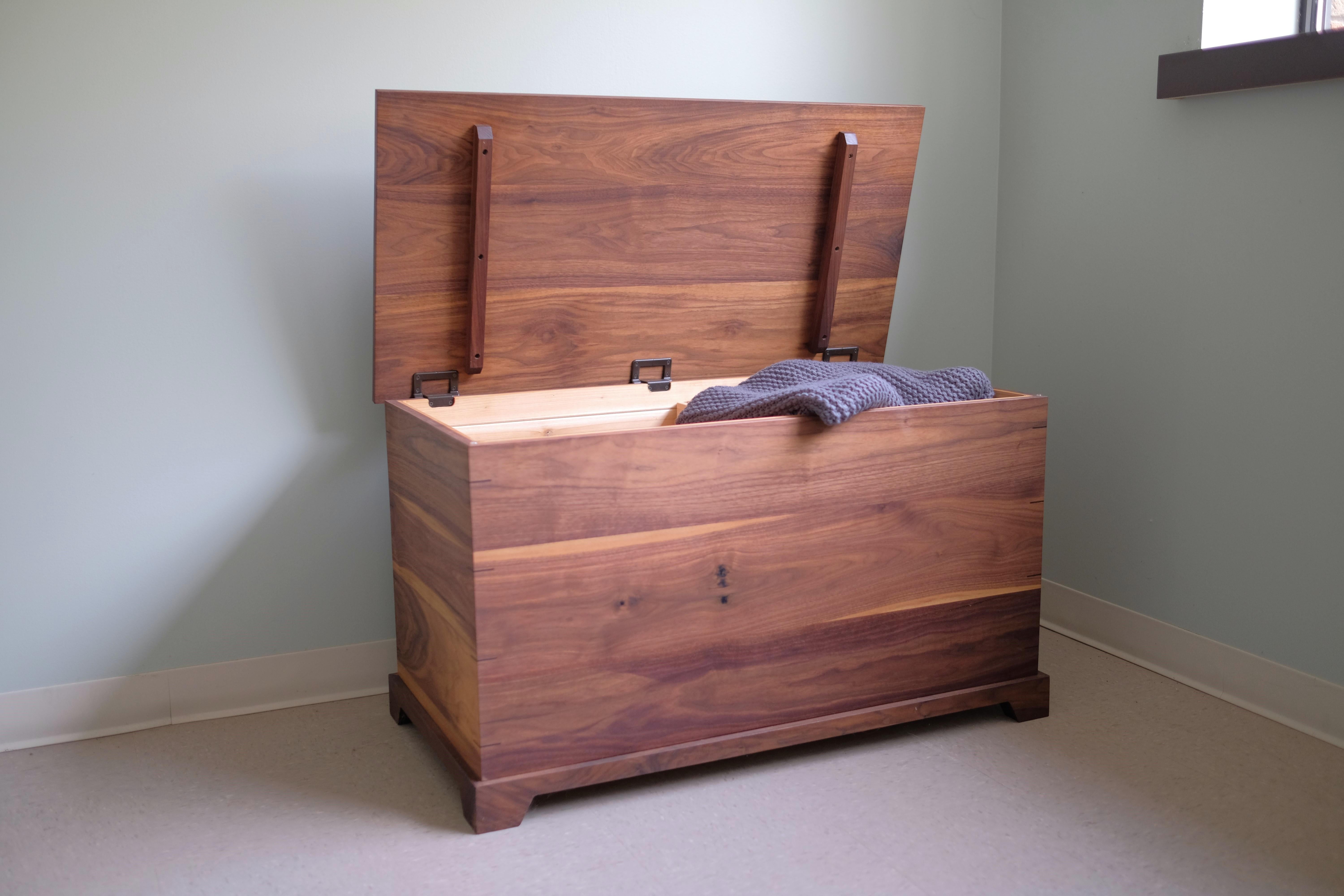 Our walnut storage trunk is heirloom quality, cedar lined and built to last generations! Handcrafted in our furniture studio and wood shop in Michigan. Assembled from premium Walnut and lovingly hand finished with a traditional hard wax oil. The