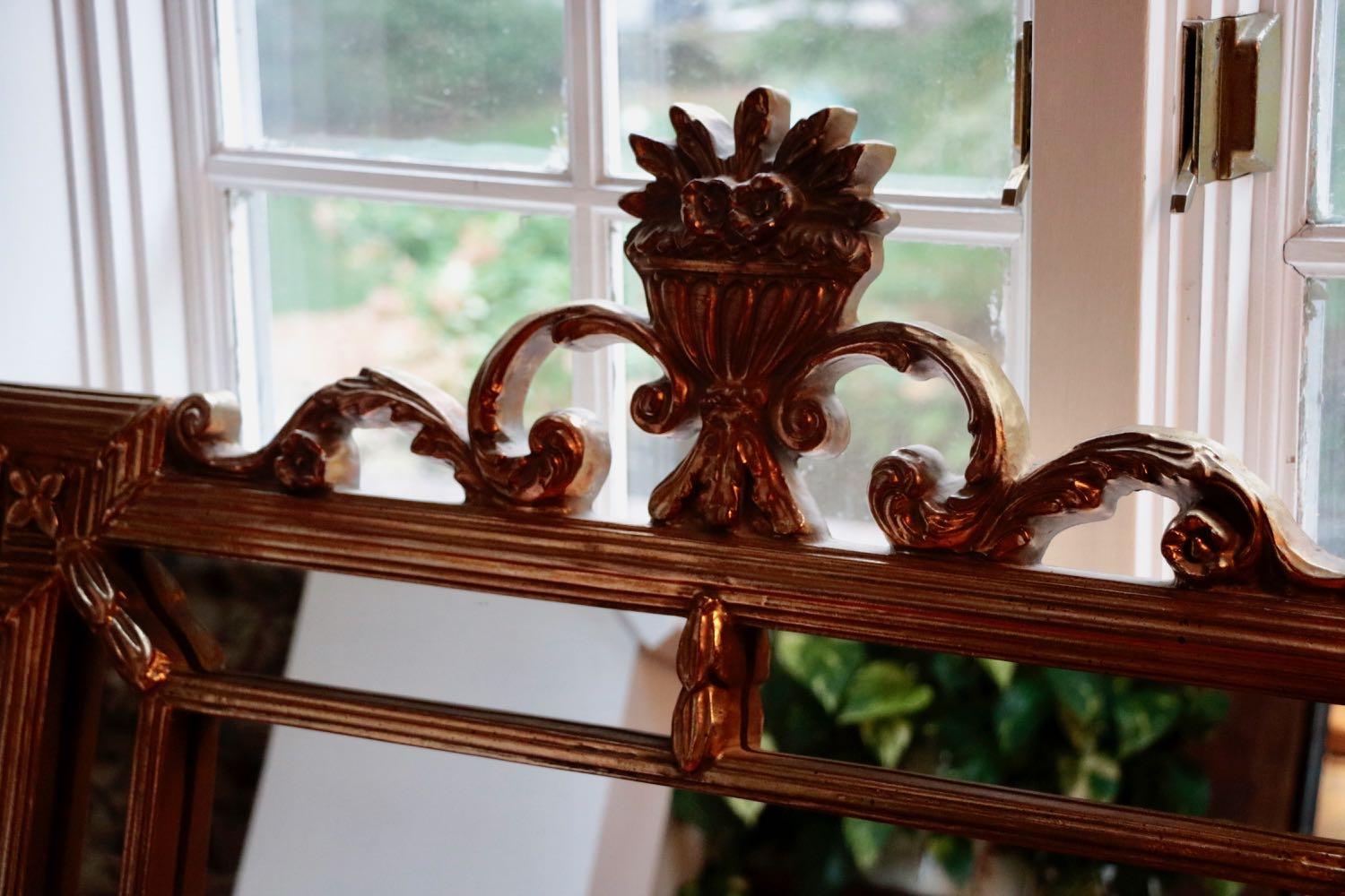 Heirloom quality Horchow gilt mirror basket of flowers atop magnificent carved beauty! A statement piece to complete any room. Intricate carved dividing panels each with its own mirrored piece all united into one exquisite and detailed vintage