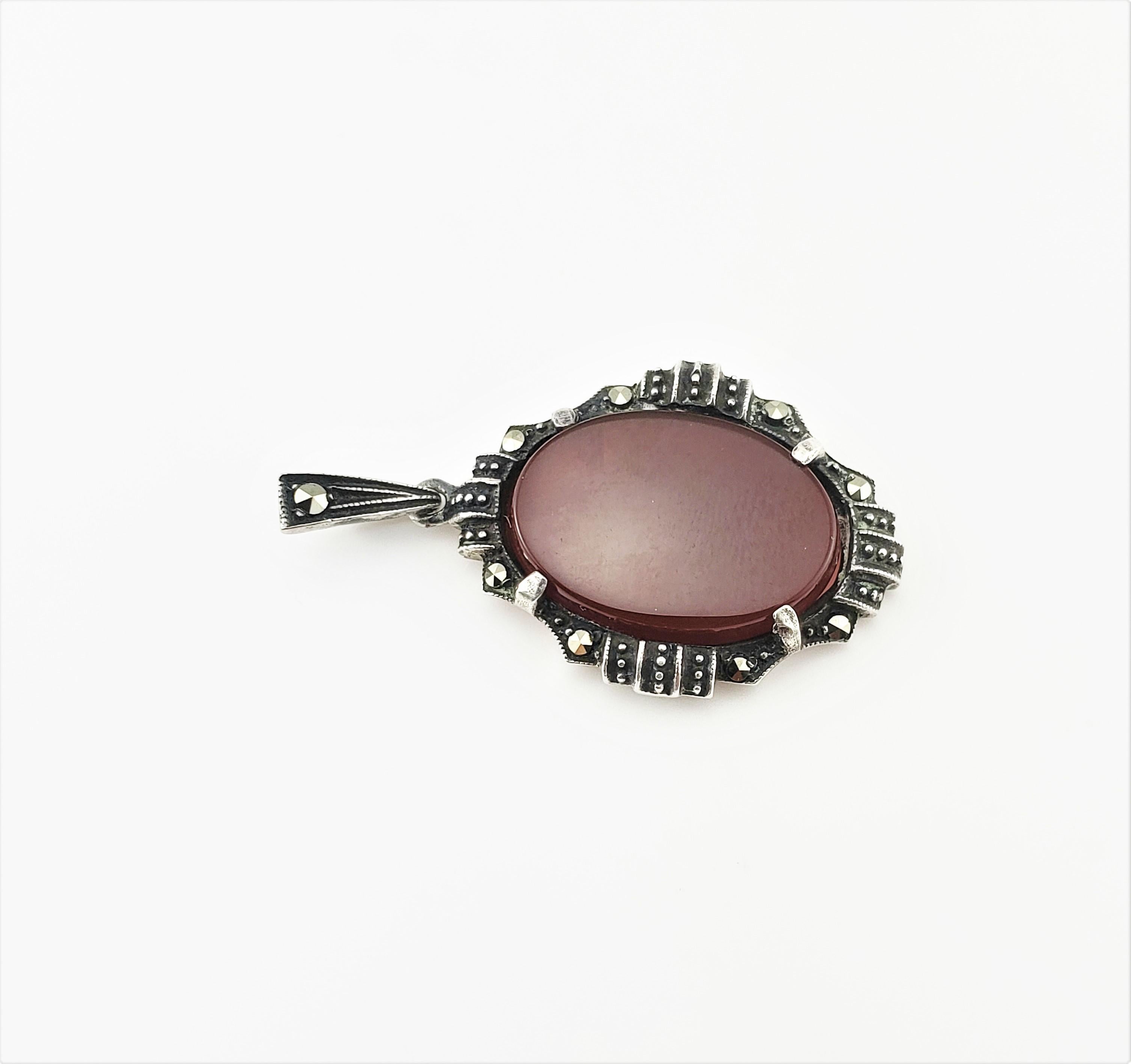 Vintage Heirloom Vintage Sterling Silver Marcasite Carnelian Pendant-

This lovely marcasite pendant features one oval carnelian (17 mm x 12 mm) set in beautifully detailed sterling silver.

Size: 1 3/8