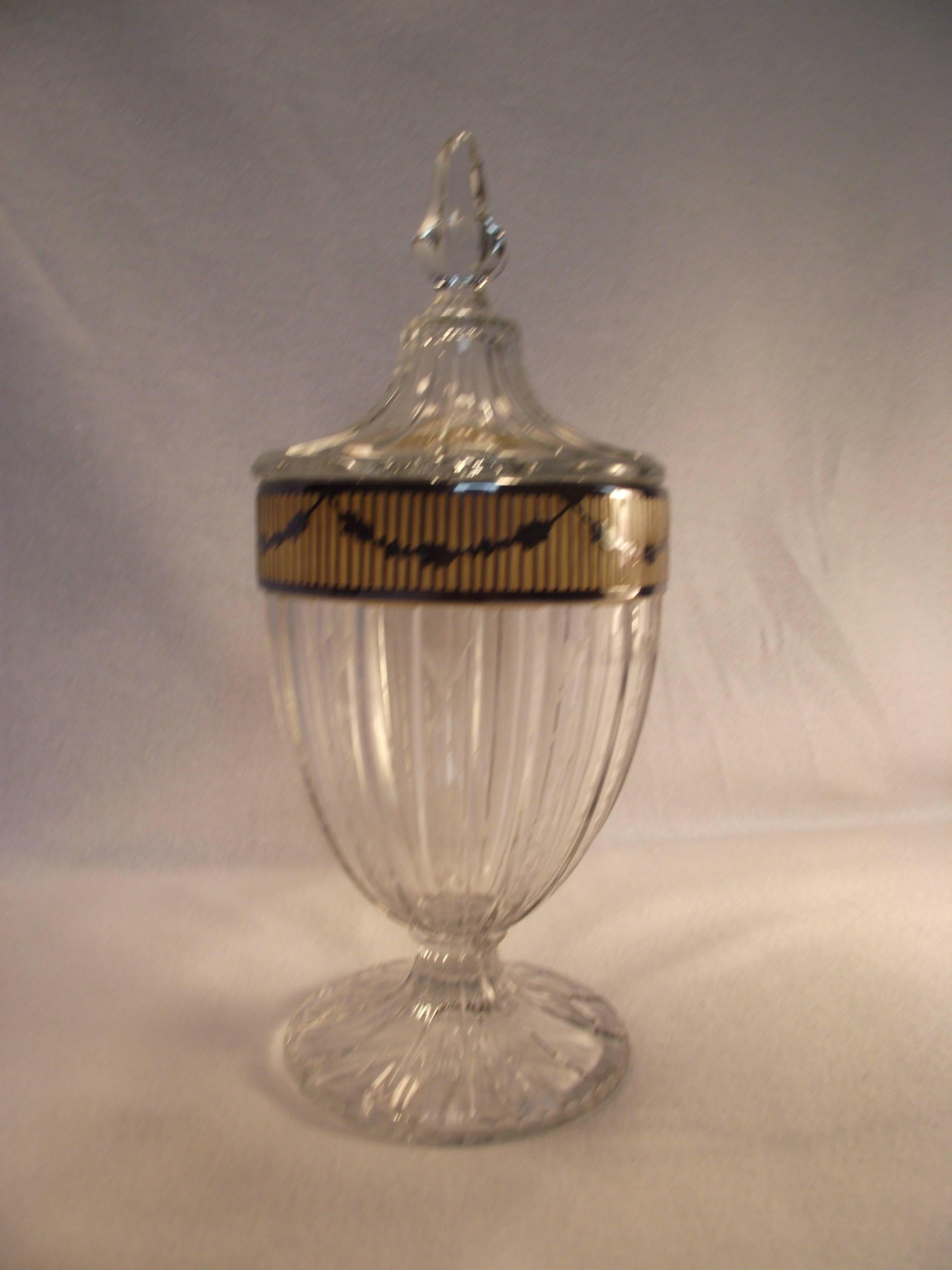 Beautiful sterling inlaid cut-glass candy dish by Heisy Glass. It is in perfect condition. The sterling inlay is detailed, beautiful and lacquered so no tarnish to worry about. It has a barely legible monogram. A great piece.

Founded in 1895 by