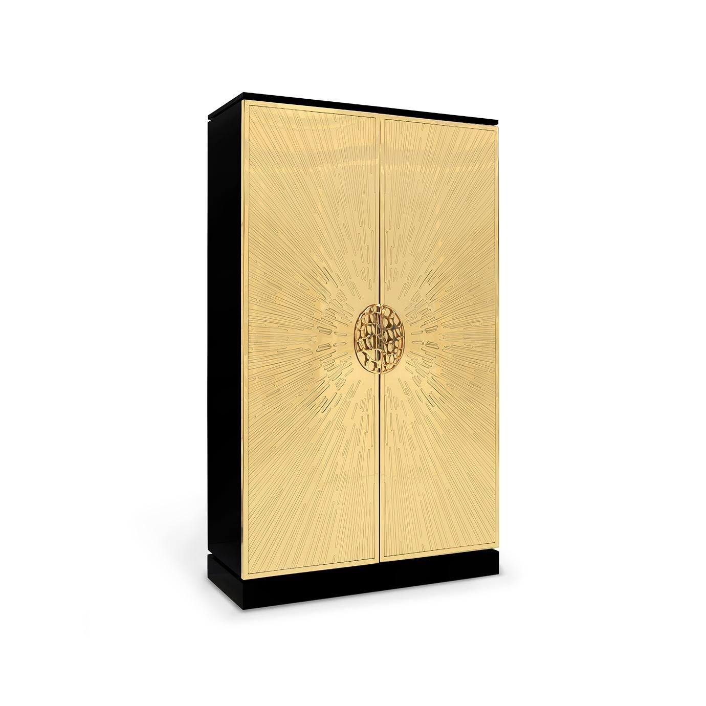 Dripping like honey with KOKET glamor, Heive is the Queen Bee of timeless black and gold cabinets. The alluring golden doors feature an exploding sunburst design enchanting you at first glance. For her majestic crowning touch, an enticing honeycomb