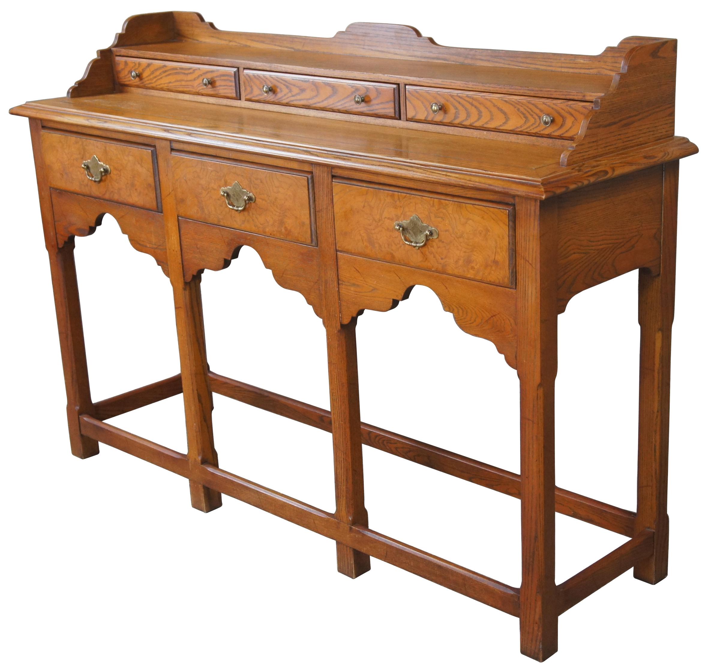 Hekman Furniture chinoiserie sideboard or hall table, circa 1970s. Made from oak with olive ash burled lower drawer fronts and brass hardware. Features a stepback design with upper drawers for storage and shaped backsplash. Supported by six straight