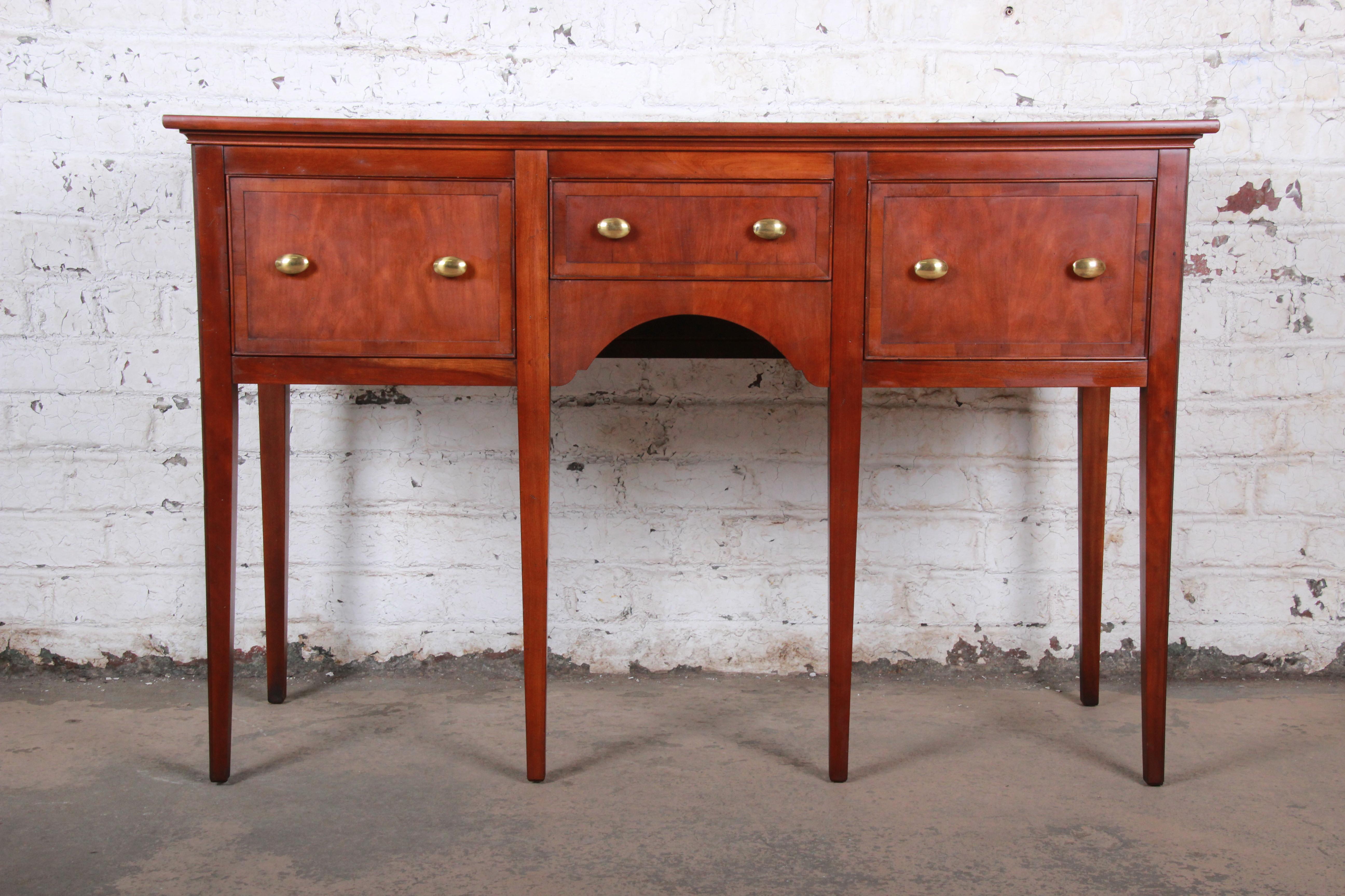 A gorgeous regency style sideboard or credenza

By Hekman Furniture

USA, circa 1970s

Cherry + yewood + brass hardware

Measures: 56